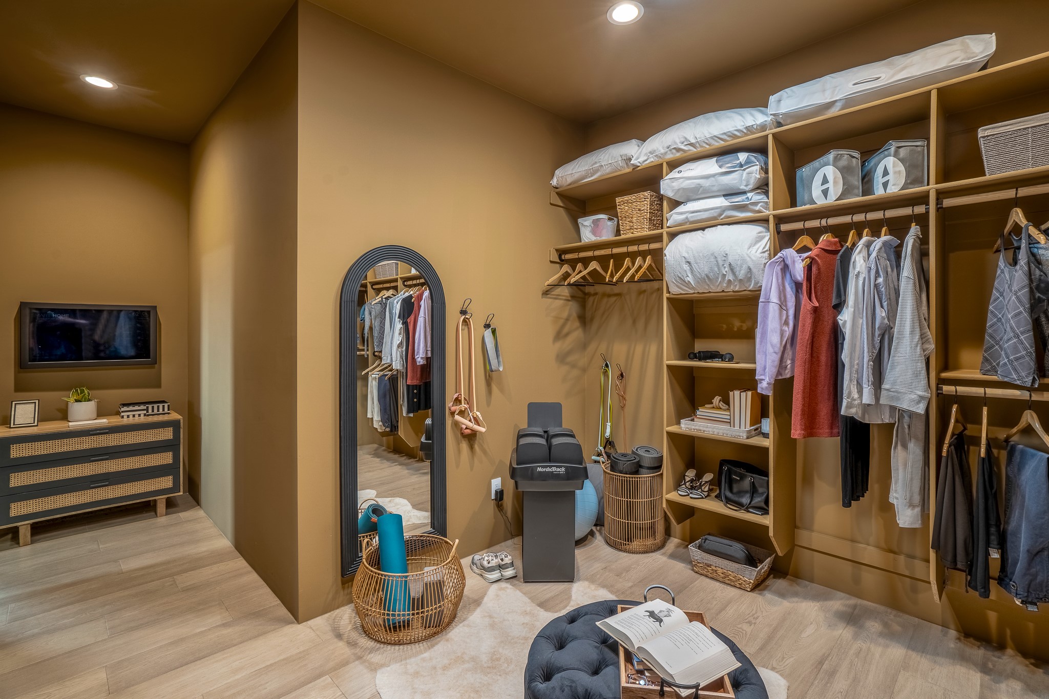Owners suite walk in closet with DAK calendar/weather, and photo streaming technology
