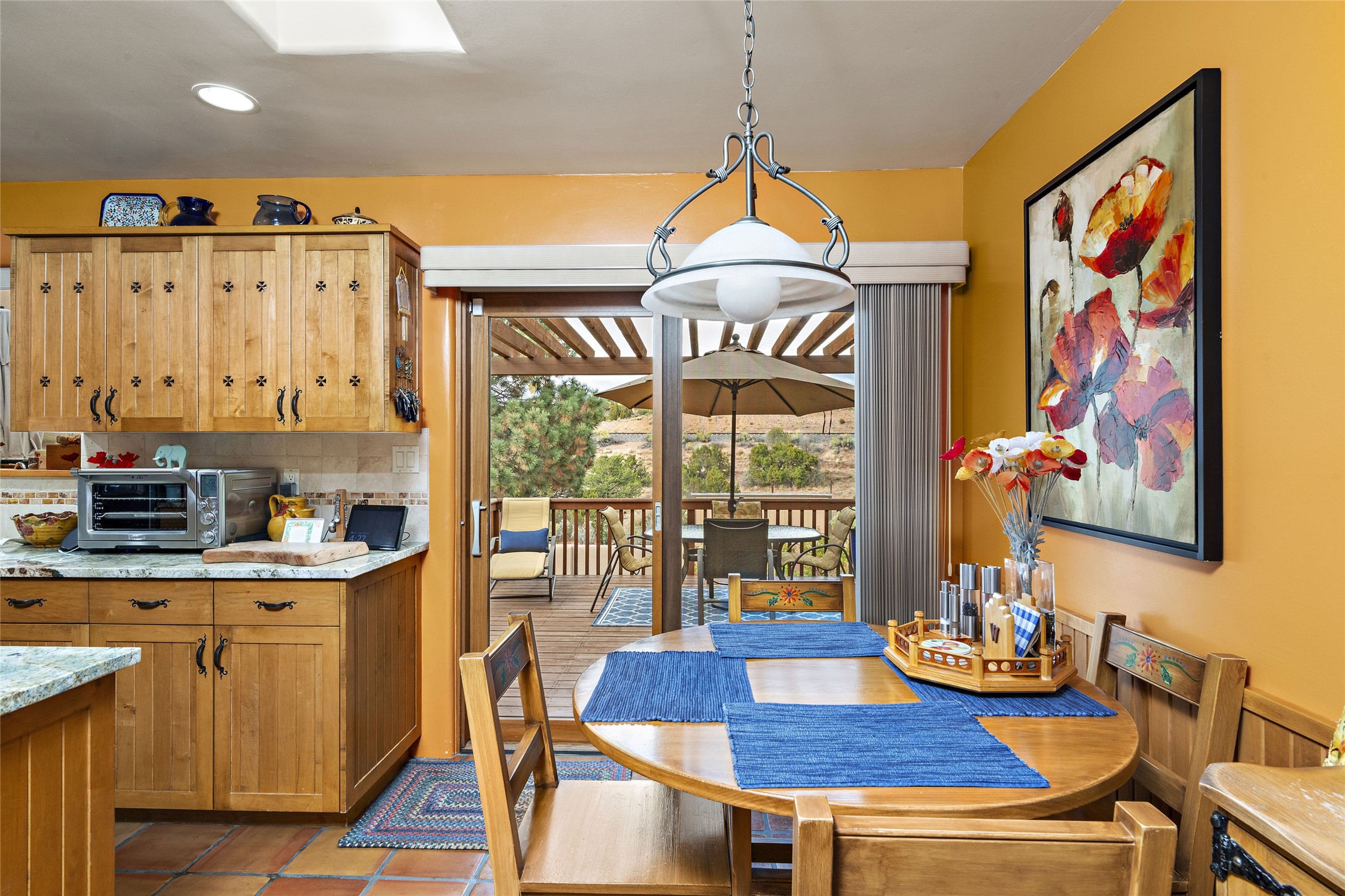 Eat in kitchen area with view out to deck overlooking the backyard