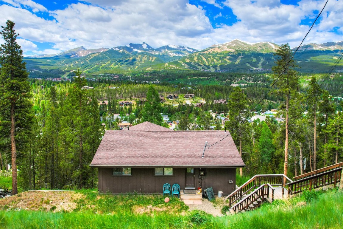Enjoy some of the best views in Breckenridge with a great location just above town on a quiet street.  Expansive views of 10 Mile Range!  This property has two dwellings. 3bd/1bth upstairs and 2bd/1bth downstairs, each w/ own W/D. Great opportunity for a local to own their own home and have an income producing rental property or investor to long term rent! Occupant must work 30hrs a week in Summit County/no appreciation cap. Exterior stained/new roof since photos taken.