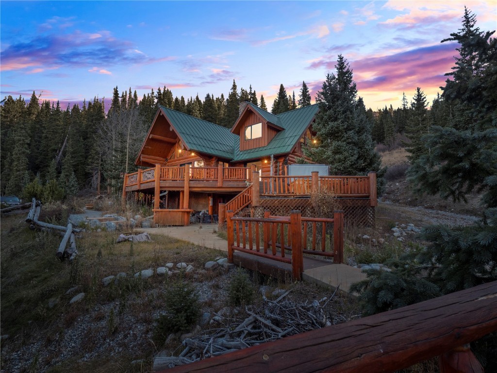 Elk Ridge Ranch is a handcrafted log home with Bristlecone accents overlooking its own private sledding and ski runs as well as a barn with a separate caretakers residence. Built on over 48 acres, this home is adjacent to National Forest with breathtaking views of the Mosquito Range and many 14,000 foot peaks. Take this ranch to the next level and make it your family's mountain getaway. This is a one of a kind property that is just 20 minutes to downtown Breckenridge!