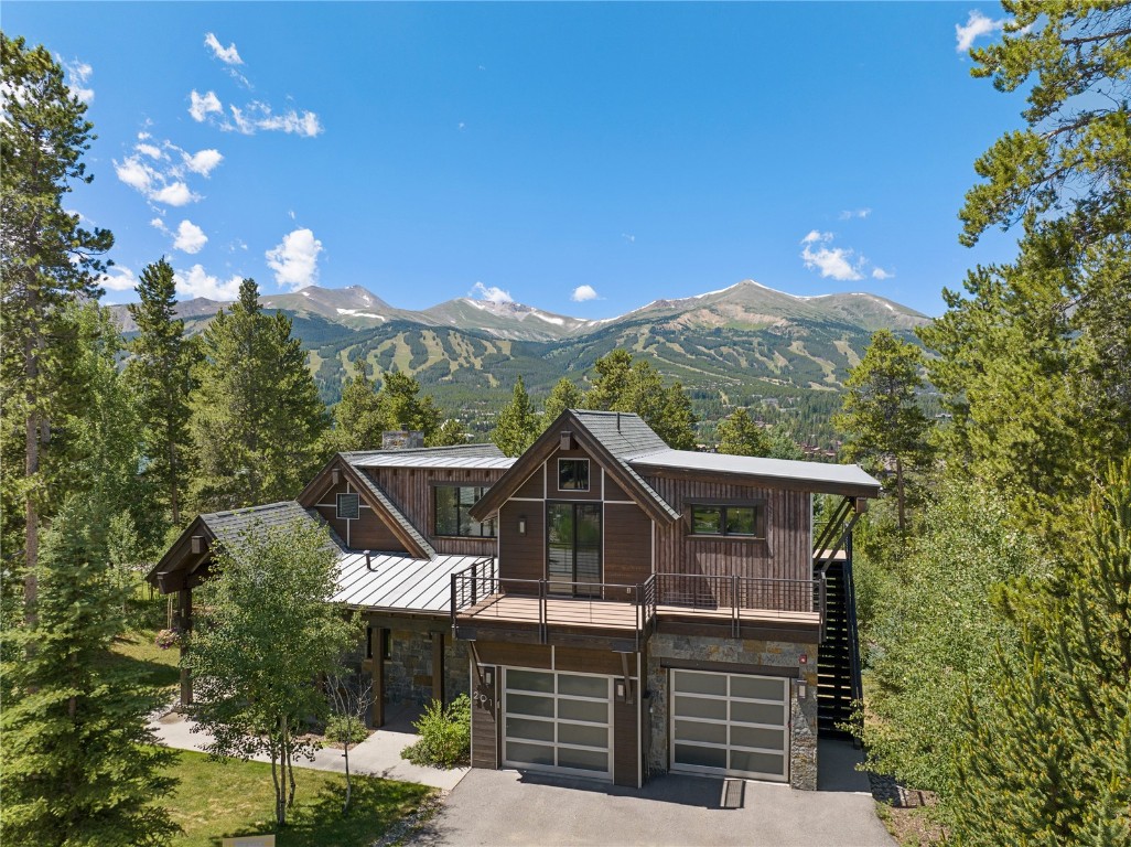 Contemporary mountain elegance in the heart of Breckenridge. Majestic views of the town and surrounding mountains frame this stunning Allen-Guerra designed home.    Unique steel trusses and fireplace, collapsible glass wall in the main living-space, all combine to set this home apart. Decks bathed in southwest exposed light. Adjacent trails provide access to pristine forests, and the historic downtown streets lined with quaint shops and restaurants. A legacy property that is a sight to behold.
