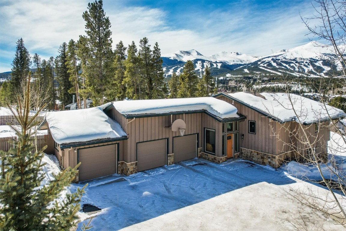 Some of the finest views of the Ten Mile Range and Breckenridge Ski Resort from this ideal in-town home.  Convenient and walkable to everything in Breckenridge, ski bus stop nearby, and a large lot offering a beautiful setting and lots of privacy.  The home boasts a large great room with fireplace, 2 private lower levels, great outdoor spaces, large 3 car garage, and a partially fenced yard.  Lots of possibilities to enjoy the home as it is, remodel, or to completely redevelop the property.