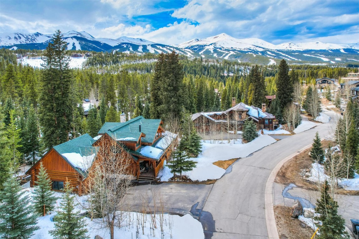 This incredible custom log cabin offers privacy, mountain views and trout fishing on your own private section of the Blue River, all within walking distance to downtown Breckenridge with easy access to the slopes & everything Breck has to offer. Cabin designed to accommodate large gatherings with 3 living areas, 5 Bd + loft, 6 Ba plus extra bunk beds in the downstairs rec room. Enjoy this amazing mtn setting from the hot tub on the expansive wrap-around deck. New roof in 2022, wood FP, and NO HOA fees!
