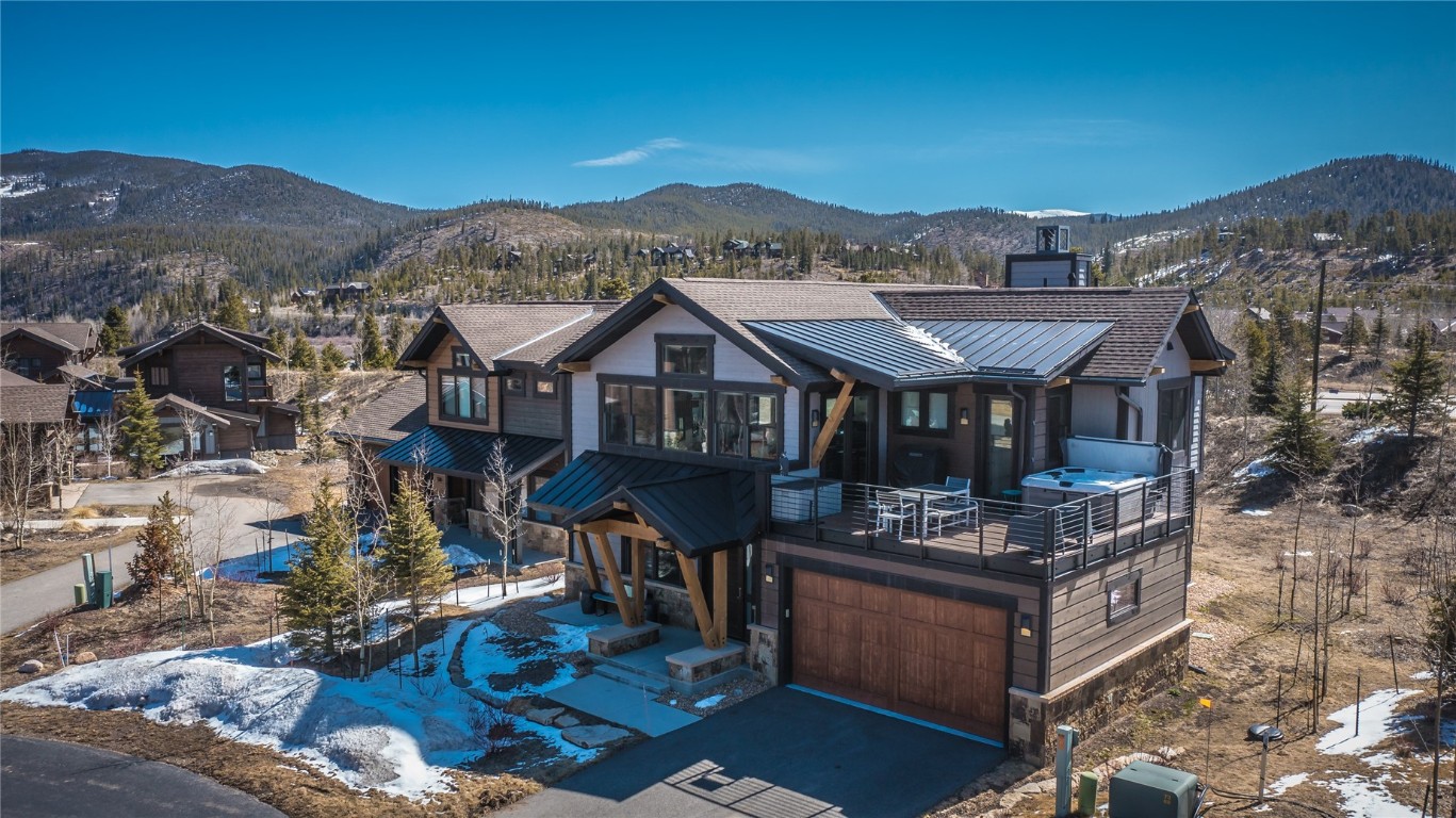 Newly painted! Single Family Home in the Shores Subdivision is a stunning mountain modern retreat with unmatched ski area views. Open-concept living space features a cozy fireplace and gourmet kitchen. The master suite has a private entry to the large deck showcasing a hot tub and breathtaking ski area views, two additional bedrooms are located on the lower level along with another living area. Meticulously landscaped and only minutes from the slopes, dining, and shopping makes it the ultimate mountain getaway