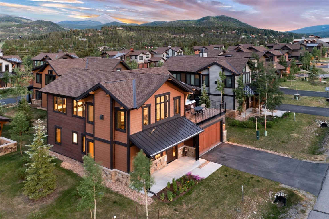 Under breathtaking vistas of the Breckenridge Ski Resort, and set along the shores of the Blue River, this stylish, mountain-modern home awaits. With exquisite, contemporary design and high-end finishes throughout, this residence is a touch of refinement in the midst of the great outdoors. Sweeping views of the Tenmile Range anchor the open concept floorplan, an expansive deck, and one of the most generously-sized yards in the neighborhood brings the outside in. Comfortably host with three ensuite bedrooms, a large second living space, and a new hot tub. Whether it's fly-fishing on the Blue River, cycling or nordic skiing on the Breckenridge bike path, hiking the Colorado Trail, or teeing off at the Breckenridge Golf Club, outdoor recreation opportunities abound in the coveted Shores neighborhood. Private river access, National Forest trails, and the Breckenridge-Frisco bikeway are just steps from your front door. Escape to one of the most sensational settings in all of Summit County, while only 3.6 miles from the Breckenridge gondola and historic Main Street, and centrally located to 6 world class ski resorts. Discover uncompromising mountain luxury at the most attractive price in this exclusive neighborhood!