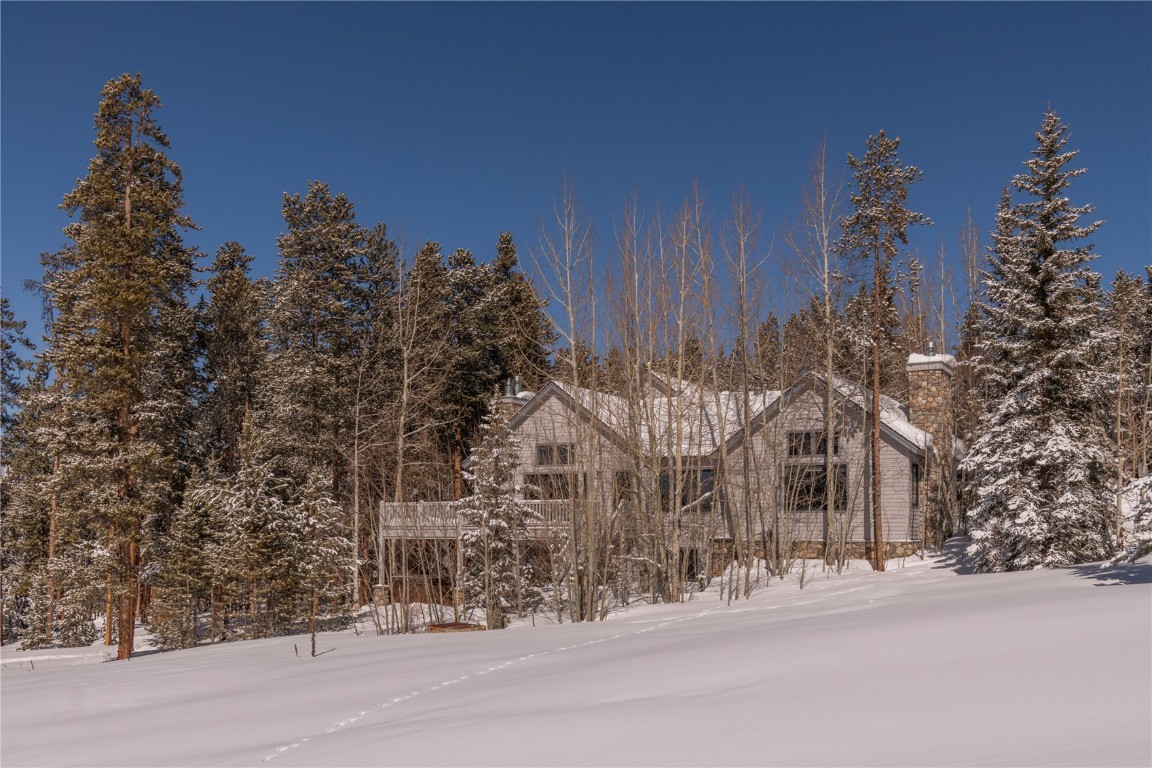 This home sits on a beautiful, treed lot at Keystone Ranch and offers a very private yet convenient location. Inside you'll love the exposed beams, the huge windows, and classic Keystone style this home offers. Every room and every window is perfectly planned to bring in the Colorado sunshine and golf course, pond, and mountain views. The primary suite is located on the main floor as are two additional bedrooms, an open kitchen, and a dining table that will serve a large gathering of friends and family. Enjoy the family room on the walk-out lower level, private hot tub, and an overall outstanding floorplan. From this home, one can waLk right to the tennis and pickleball court, the Ranch pool, the golf clubhouse, and the Keystone Ranch Restaurant. This home has been extensively updated and is ready to enjoy this upcoming season!