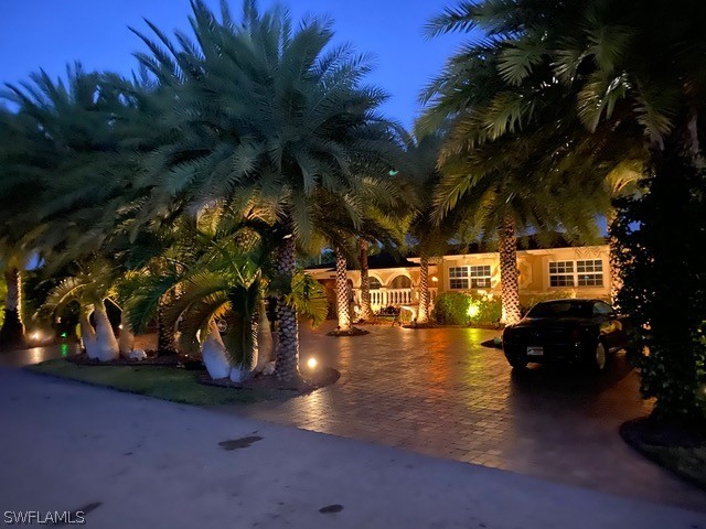 No interior damage from Hurricane Ian!  Minor fence and landscaping damage that is being addressed this week. 
 This private Florida style home is fully equipped with the Control4 Smart Home System.  Touchscreens are located in all rooms for lights, security, music, and much more.  This home is surrounded by palm trees, privacy fence, and beautiful landscaping and lighting.  The heated saltwater pool area is perfect for entertaining guests.  The colored lights and outdoor speakers set the ambiance.  The interior has been completely remodeled with marble flooring throughout all rooms, including bathrooms and showers.  Also, built with sound proof sheet rock walls and solid wooden doors for peaceful living.  The updated kitchen has all stainless steel appliances and plenty of overhead lighting.  House can be purchased partially furnished.  Book your showing today!