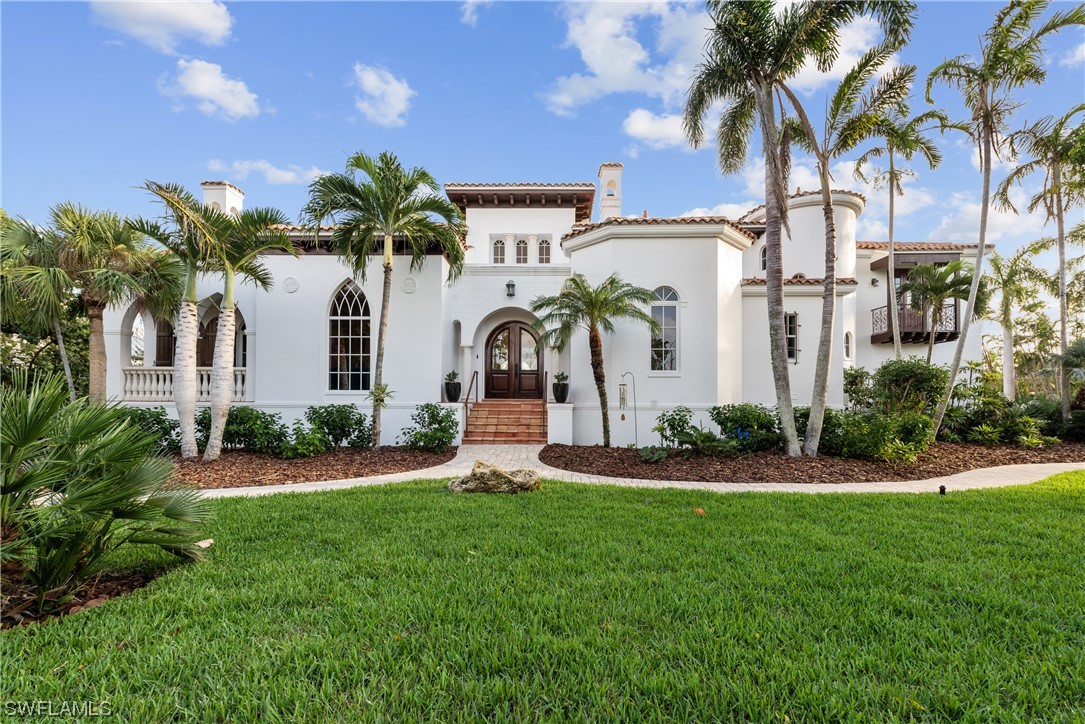 Nestled on a private 1.23 acres in Sanibel's affluent neighborhood, this luxury Mediterranean-style home exudes timeless European charm. With captivating views of the exclusive lake, this residence showcases meticulous craftsmanship from Colombian handmade clay roof tiles to grand cypress doors. The elegant decor is included in this turn-key, fully equipped & move-in-ready home. Resulting a rare and effortless opportunity. The layout includes: library, office, 2 lofts, 3 beds, 3 baths & nearly 4K sf, featuring marble floors, ornate moldings, 16" cecilings, an a barrel ceiling in owner's suite. The 3 balconies, large lanai w/kitchen overlook the pool-spa & lake. The property also features an oversized 3-car garage w/ electric vehicle charging station. Recent energy-conscious upgrades include a 7kw Enphase solar panel system,high-efficiency HP water heaters, and 18-SEER AC units, reducing electric cost by 50%. Enjoy a sustainable lifestyle without compromising luxury. Prime location near central Sanibel and bayside park --this property offers more than a home, it's a lifestyle. Immerse yourself in the beauty of premium construction with tranquility-environmental conscious living.