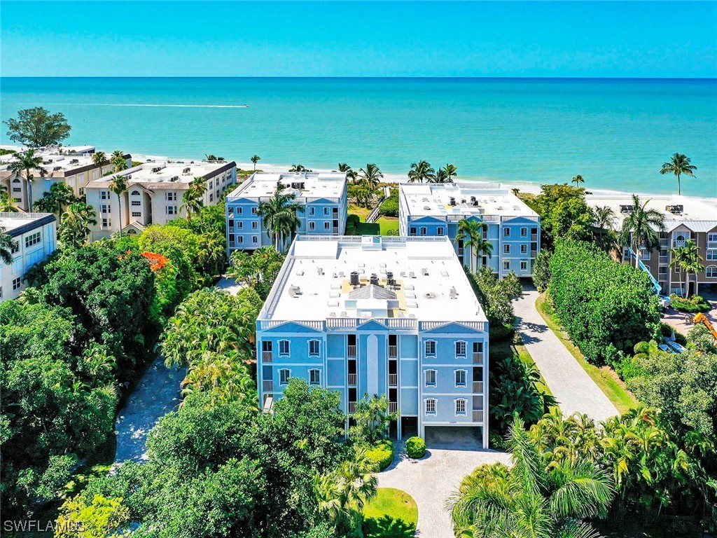 Seascape of Sanibel 302 is well-located, high-end condominium complex offering highly sought-after spacious units!  Seascape 302 is a first floor west corner unit with 3 bedrooms, 3.5 baths, two porches, impact windows, under building parking for 2 cars plus storage area and 3200 SF of living.  The view over the pool on to the Gulf of Mexico is mesmerizing!  Pool and tennis/pickleball on-site for the pleasure of owners/guests. Remediation is ongoing and the complex will be totally restored.  The apartments will allow a new owner to decorate the interior and plan for their total enjoyment and lifestyle going forward!