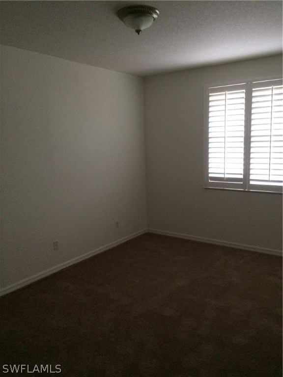 Second bedroom is carpeted and also features Plantation Shutter window treatments.