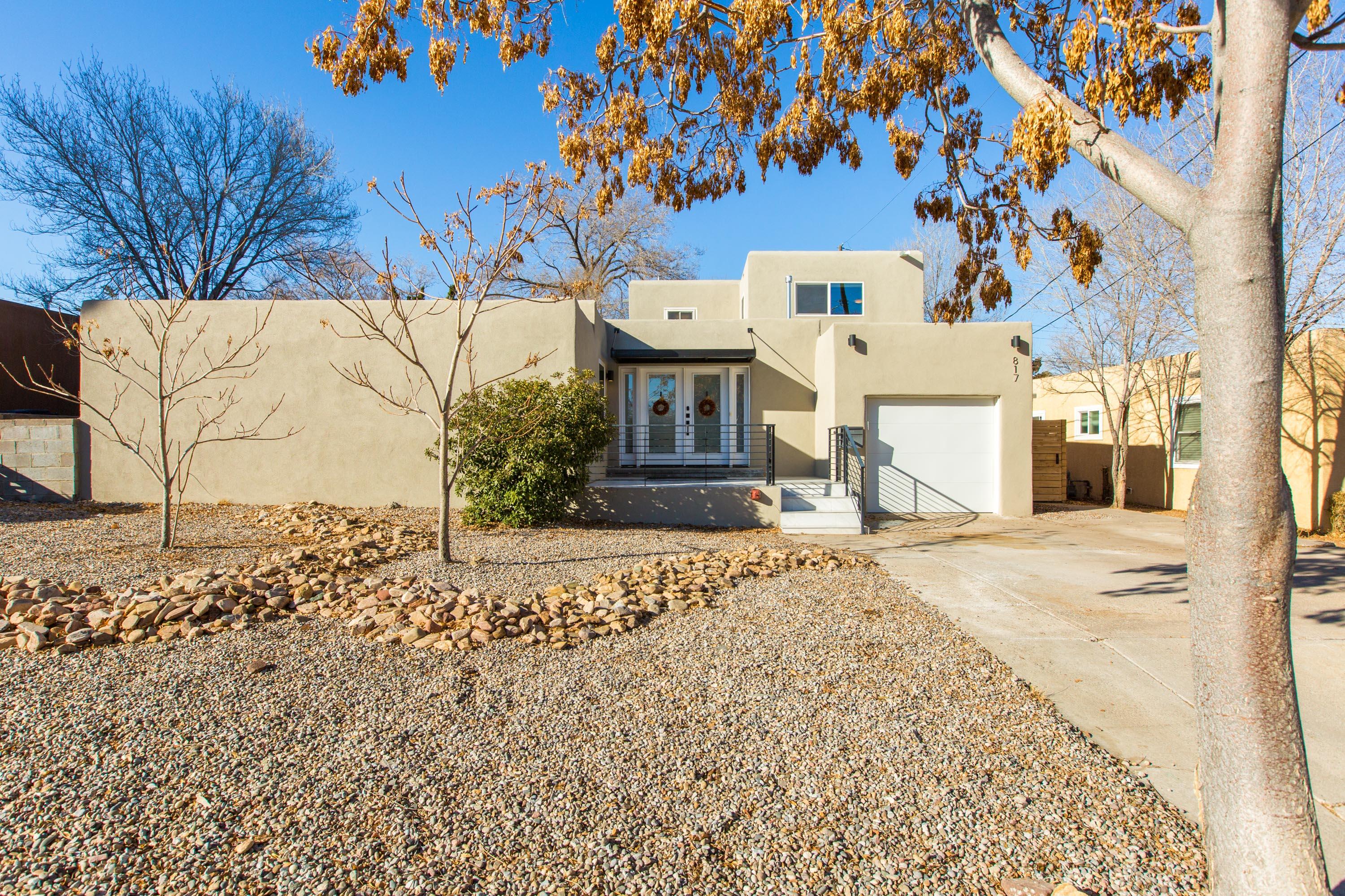 What a rarity 2831sq feet 4 bed 3 bath and a loft/office space in sought after UNM area. Home was completely renovated in 2019 to create a sleek yet thoughtful contemporary space. Gracious Foyer leads into a light filled home.  Beautiful French Oak floors, open inviting kitchen with Quartz countertops, Subway tile backsplash, Ample cabinetry, Pantry, Large kitchen Island, 5 burner stove- woodburning fireplace adds a wonderful feature to this stunning space.  On the main floor you will find an owner suite with a splendid bath and a tremendous walk-in closet also there is a 2nd bedroom on the main floor. Upstairs you will find the 3rd and 4th bedrooms and a light filled loft that works wonderfully as an office space. Home has 2 heating/ 2 refrigerated air units.