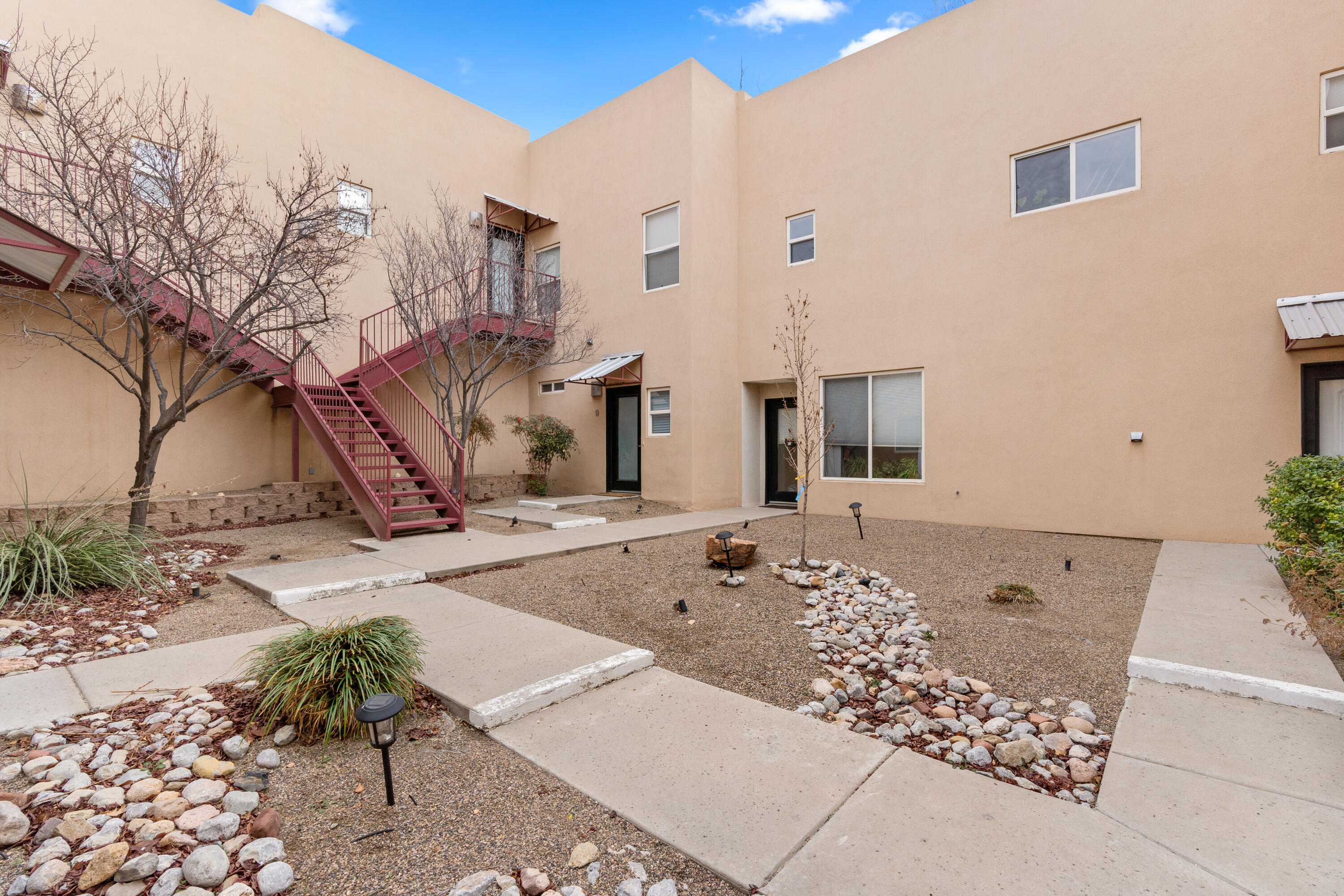This modern and upscale condo is for sale in the heart of downtown! Bright and airy, this loft boasts high ceilings with gorgeous natural lighting. A short distance to UNM with easy access to the freeway.  Perfect location for college students and traveling nurses/doctors. Includes one parking space with on-site parking. Come see this investment opportunity or first home for yourself in this private, gated community.