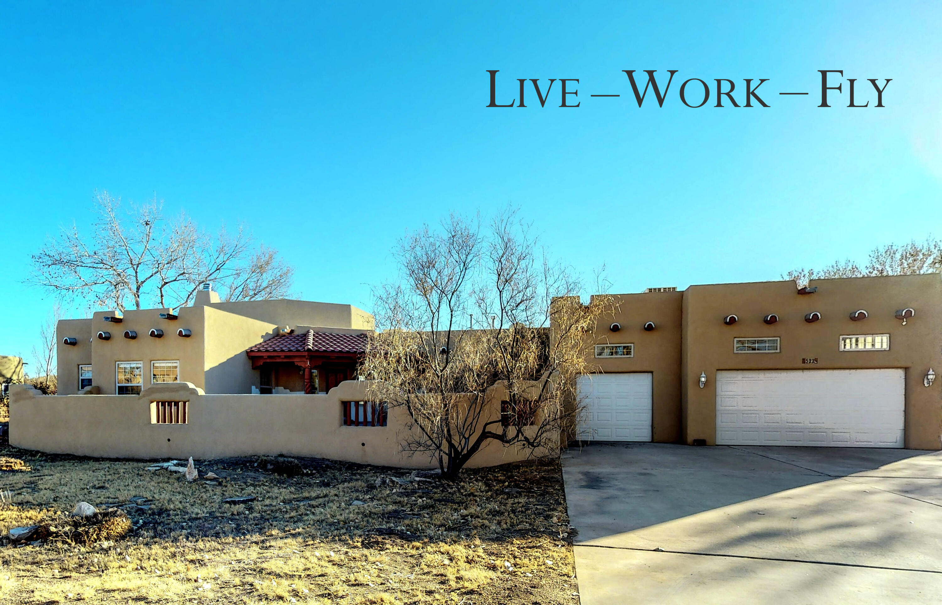 Live, Work and Fly from Home. Stunning custom, southwestern, pueblo style home situated on almost an acre in the desirable Mid-Valley Airpark community (E98). This single-story home features 3 bedrooms, 2.5 baths, an office, attached 1270 sf 5 car garage/hangar with its own bathroom and easy access to both runways. High speed fiber internet to the home through Plateau Fiber. Close to new Amazon and Facebook development, I-25, and minutes to Albuquerque. This would make a great primary or second home for anyone with an airplane, or needs a hangar as a shop for cars, toys, etc. Call your Realtor and fly in for a showing today!