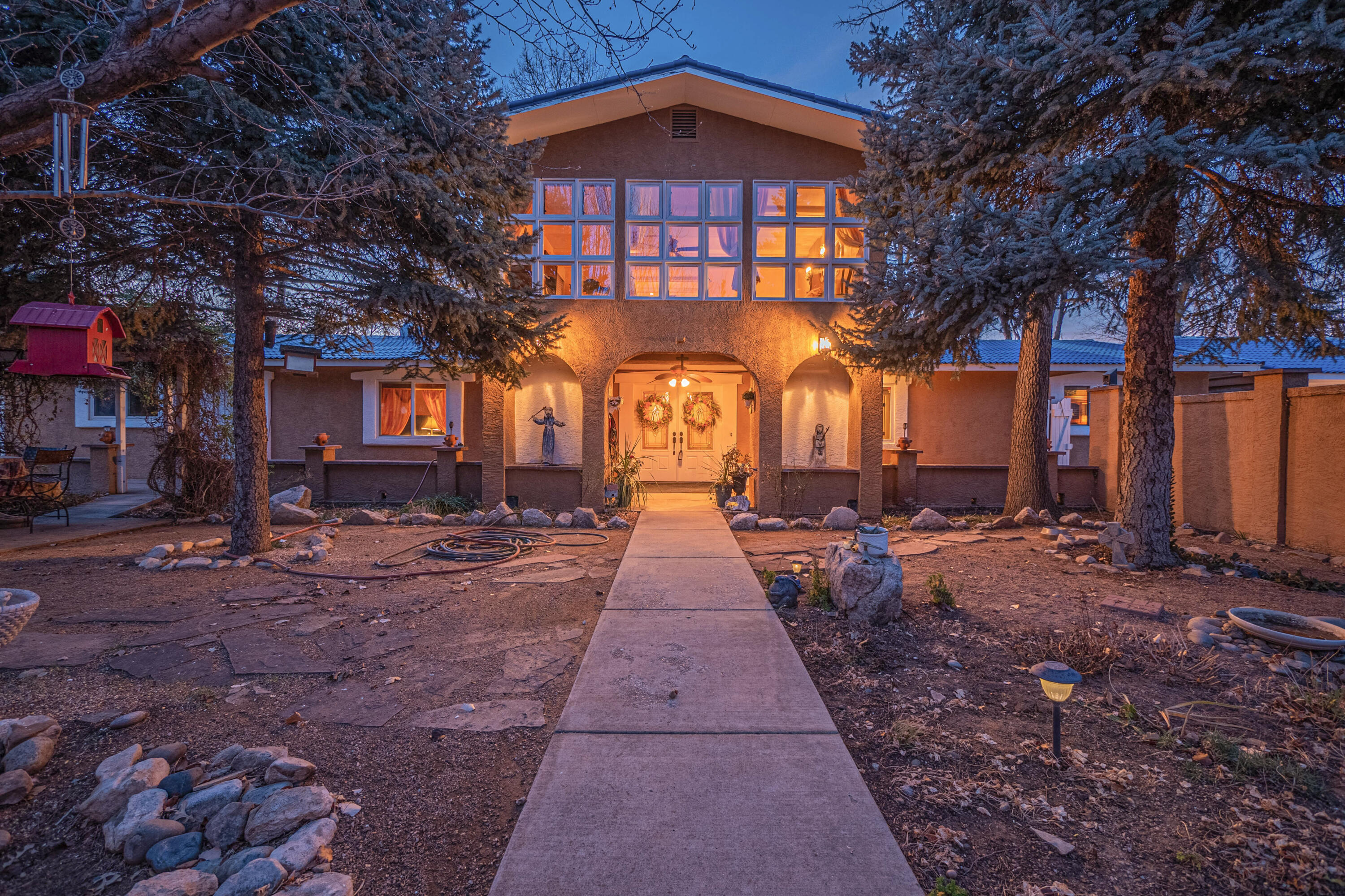 This beautiful and unique Northern New Mexico style horse property AND two bedroom CASITA, is situated down a private road in the highly desirable far North Valley. The 1.66 acre property offers fantastic views of the Sandia Mountains, easy access to the Bosque, the Rio Grande, Horse trails, walking and bike trails, as well as restaurants and shops. The newly remodeled kitchen (2020) is a home chefs dream, offering granite counter tops, 6 burner Royal gas stove with oven, a Stainless Zephr hood, a separate stainless steel double oven, stainless refrigerator, wine fridge, and breakfast bar. This kitchen is made for entertaining friends and family, and has two sets of double French doors that open up to the spectacular back yard.