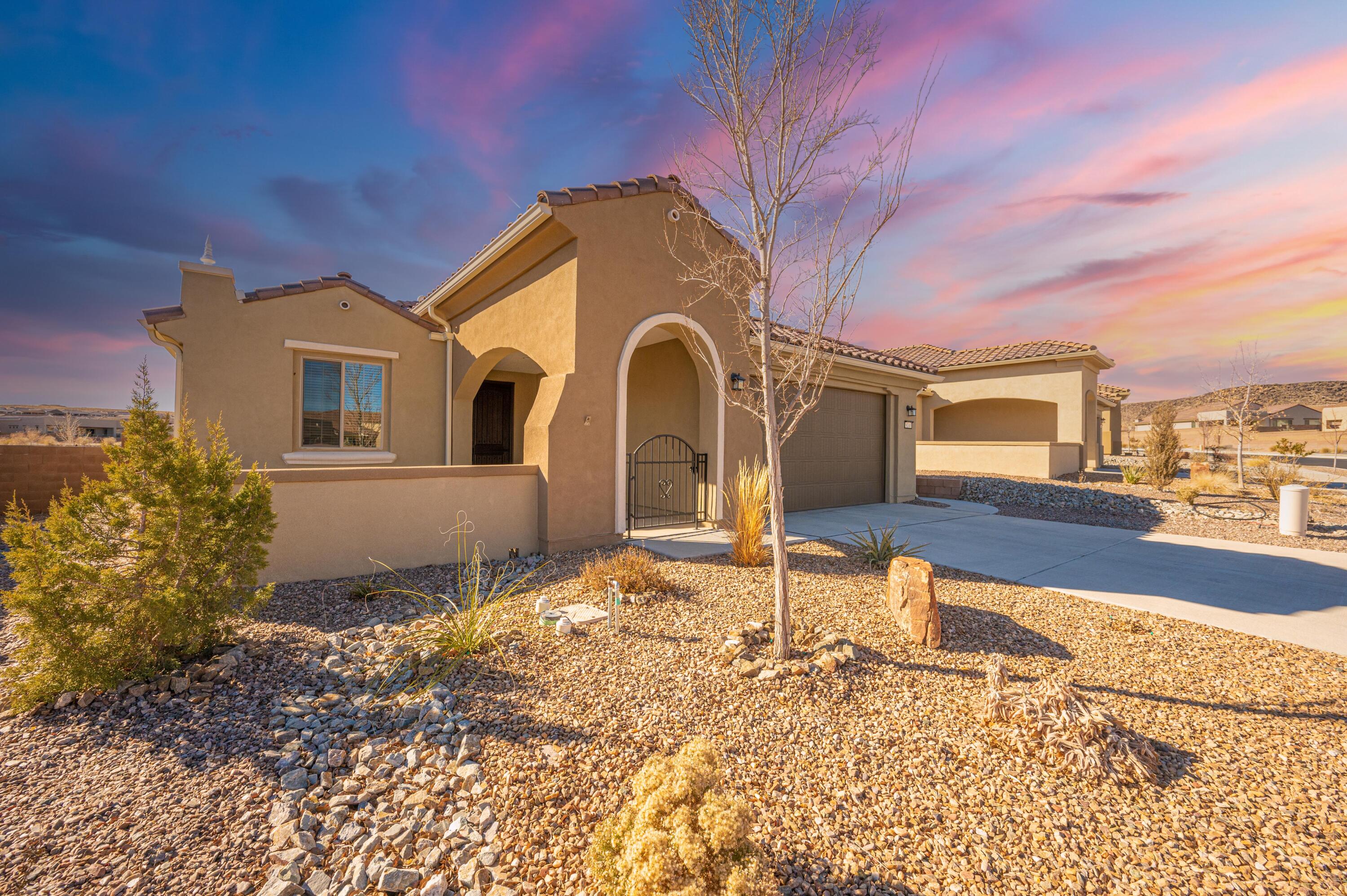 Welcome to Del Webb Mirehaven, a 55+ Active Adult Community! This 2019 built 'Sanctuary' floorplan has approx 1708 SF and is situated on a view lot! This home offers 2 BR's, 2 BA's, Chef's Kitchen w/ Large Island, Granite Counter-tops, beautiful back-splash, SS Appliances, REF AIR, Gas FP, Gorgeous ceramic floor tile, Extended 2 Car Garage with a large 10 X 11 storage space, Large Covered Patio, Professionally Landscaped front and backyard! You will love the views of the Petroglyphs and views of the city to the south and east! The Sandia Amenity Center offers daily activities, Upscale Gym, Cafe, Tennis Courts, Pickle Ball, Locker Rooms, Beautiful Pool, daily activities and so much more!!!