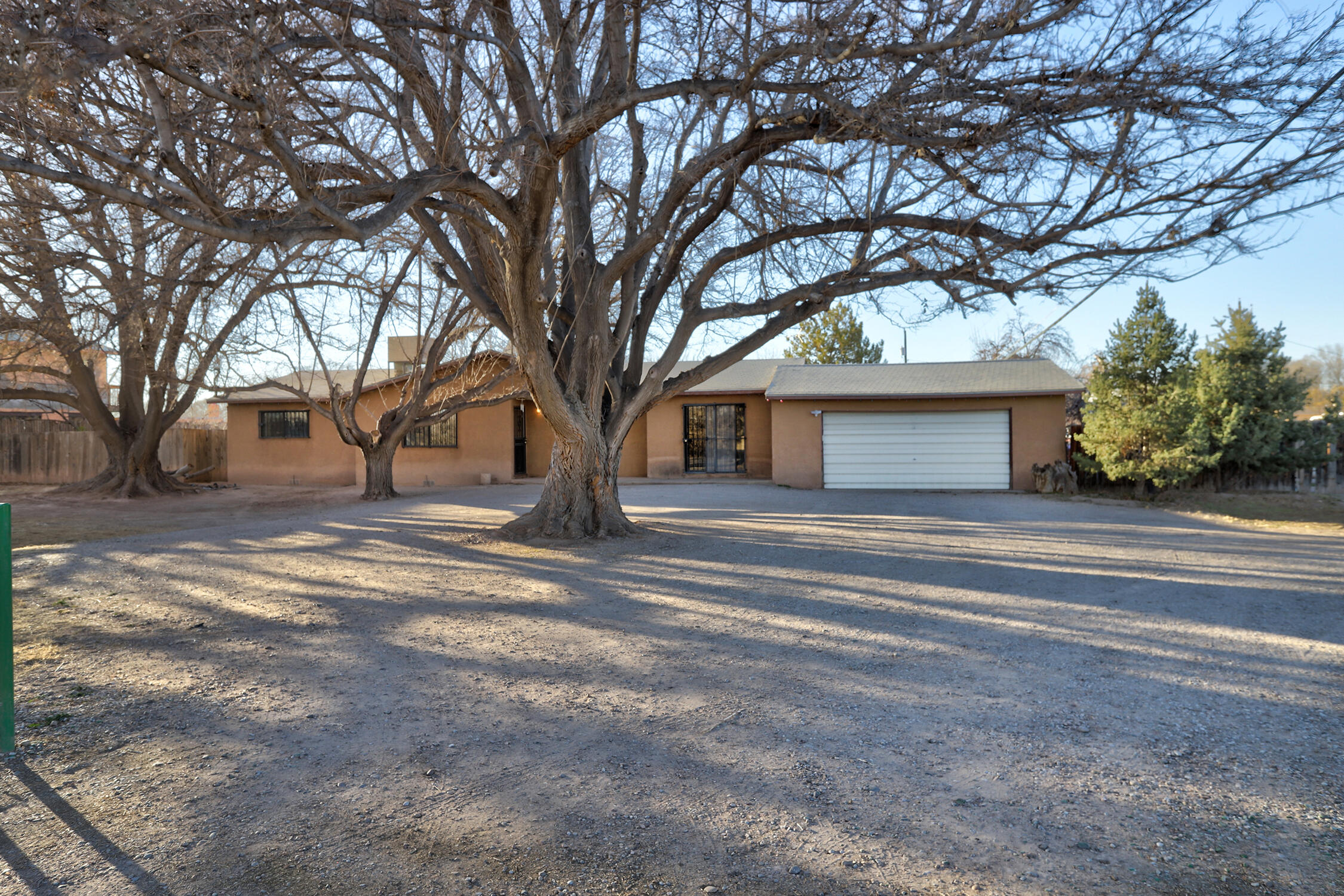Unique opportunity in the greenbelt of Corrales!!! This property is located in the Commercial District of Corrales, has pre 1907 water rights and has a 1380 square foot attached garage. Make this property a live/work property or single family home, the possibilities are endless.