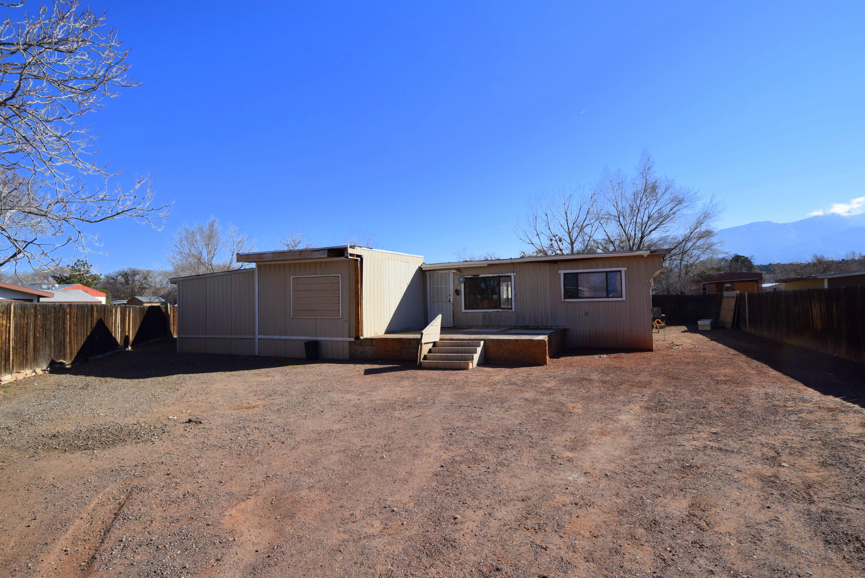 Manufactured home that needs some TLC. Could be a residence, investment, or tear it down a build a custom home. Close to the Rail Runner, parks, downtown Bernalillo. Great freeway access. Own it today
