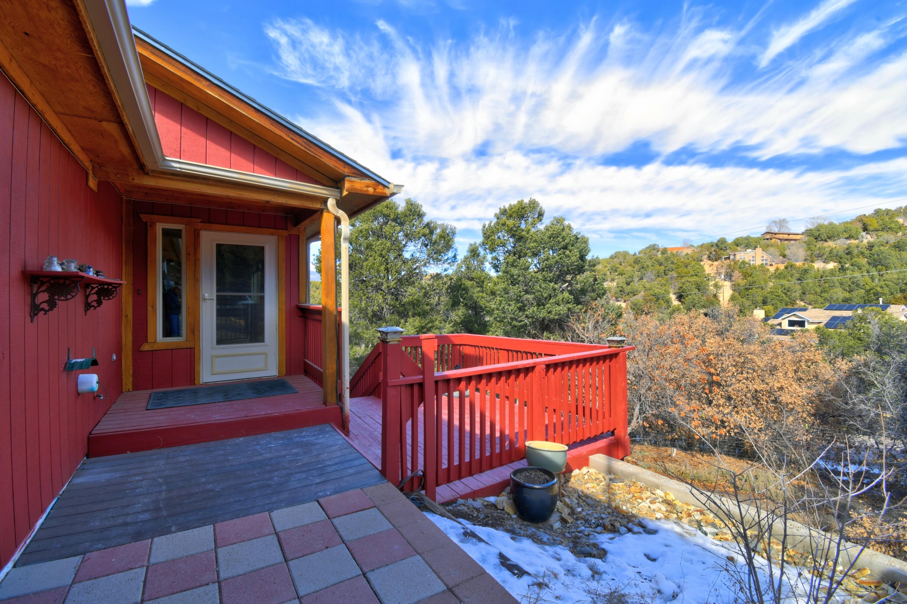 Great Mountain Home! Unsurpassed Views from the Front Deck! National Forest Just Around the Corner -Hike Forever!  Only 15 Minutes to Albuquerque on all Paved Roads. Roof was replaced in 2019, Newer Furnace and Refrigerated Air was added at the same time! Woodstove for chilly Winter Days.  Wonderful Covered Deck on the Back of the Home, just off of the Kitchen- enjoy year round! Large Main Bedroom has oversized walkin shower. Home has a fenced backyard and an unfinished basement for storage.  Two-car attached garage makes taking in the groceries a breeze!  If you are looking for an East Mountain Home, close to Albuquerque, this home is for you - it has been lovingly cared for throughout the years!