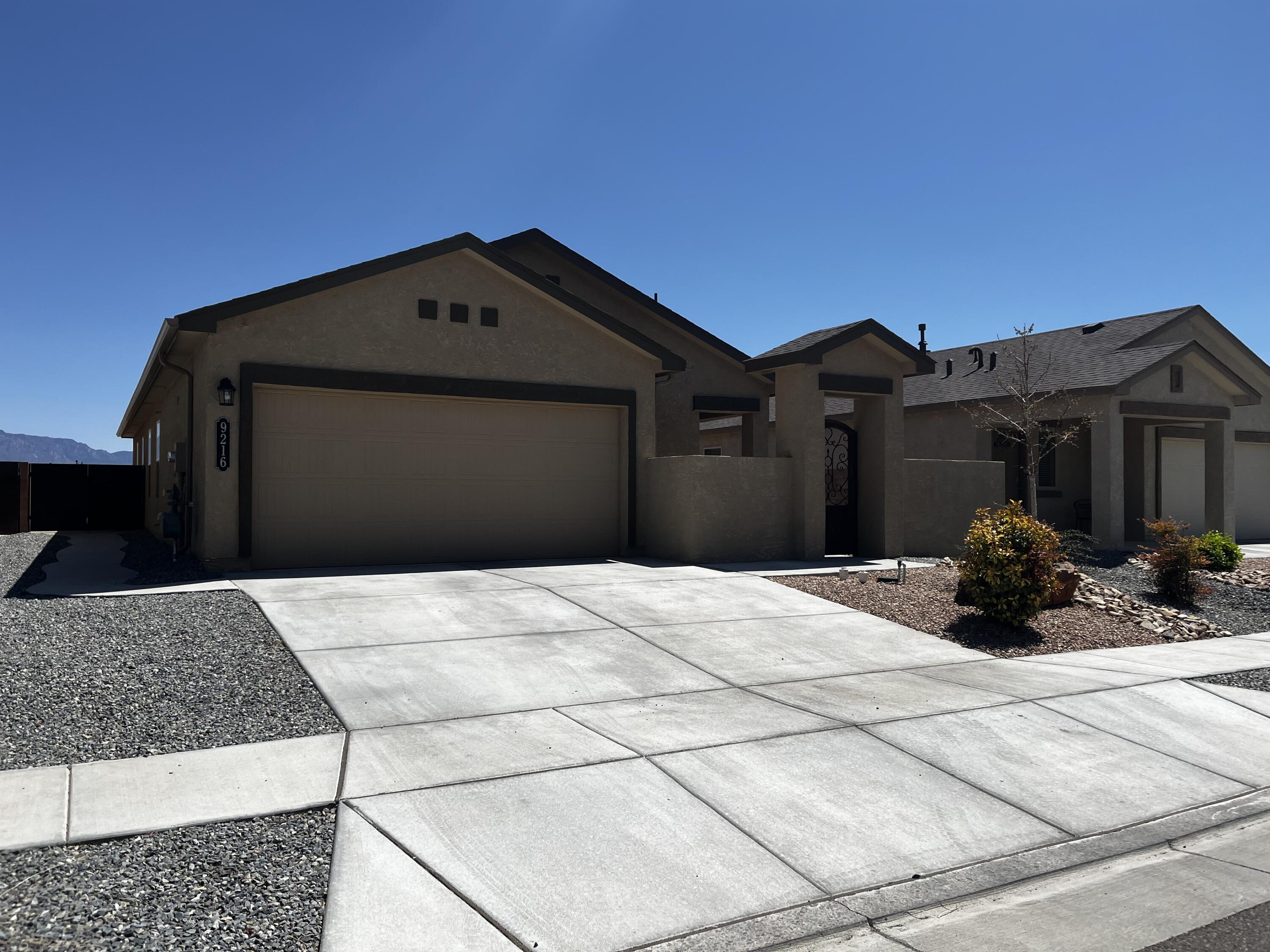 NO PID in this 2 year old home. Fully landscaped back yard with horse shoe Pit and beautiful views of the Sandias. Custom gates on the front courtyard and side gate. 3 bedroom 2 bath with granite counters and stainless steal appliance in the kitchen. 2 car garage that is finished. Come see this home and make it yours today!!
