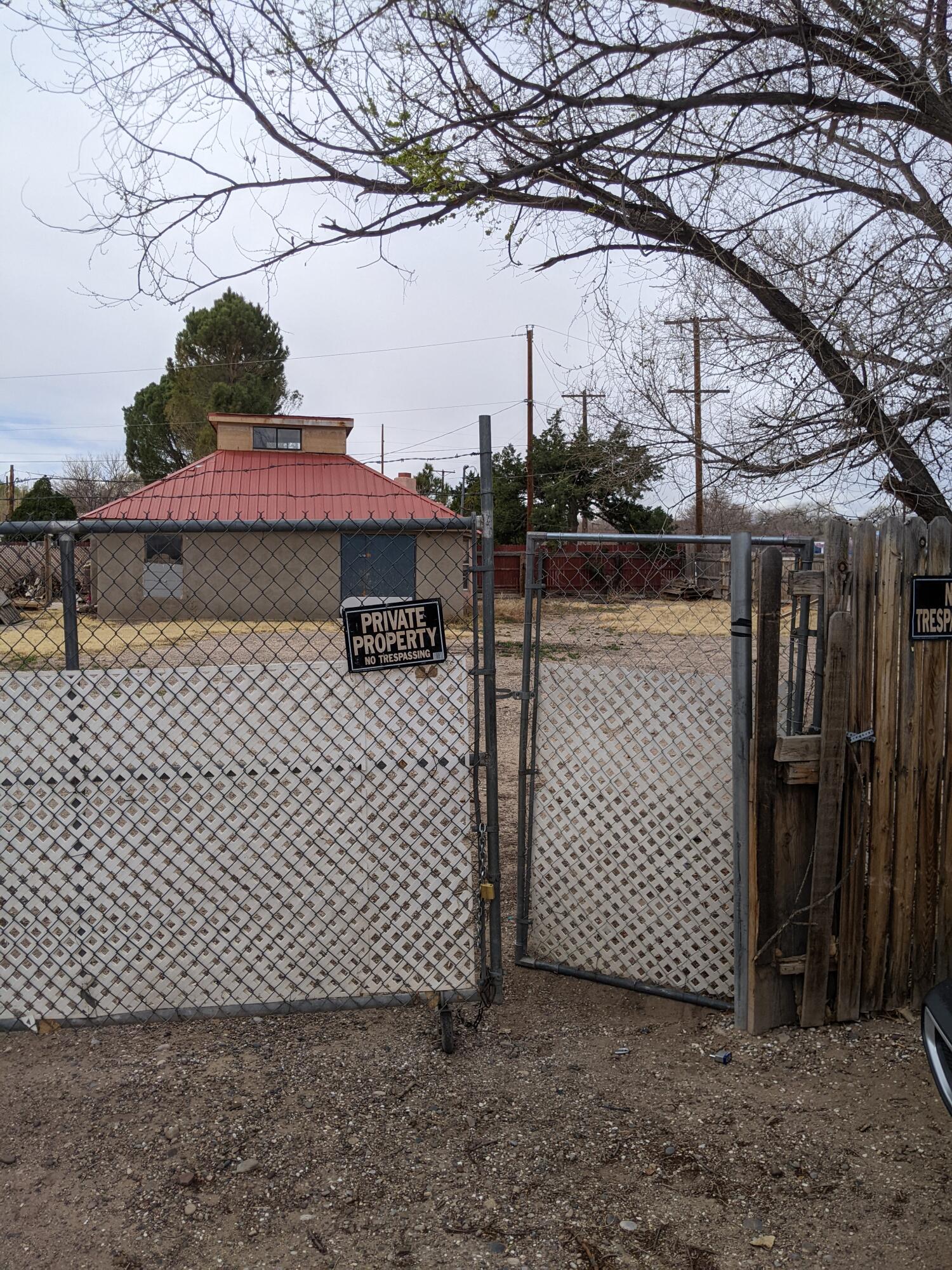 Looking for a good 1 acre lot in the South Valley? This fixer upper just might be for you!This is part of an estate sale and is being sold by the court appointed representative. There is a building on the lot with a metal roof. No utilities are on, there is an electrical box on the building and city sewer and water are available in the street.  No disclosure will be provided and is being sold '' AS IS'' with due diligence on the Buyer.