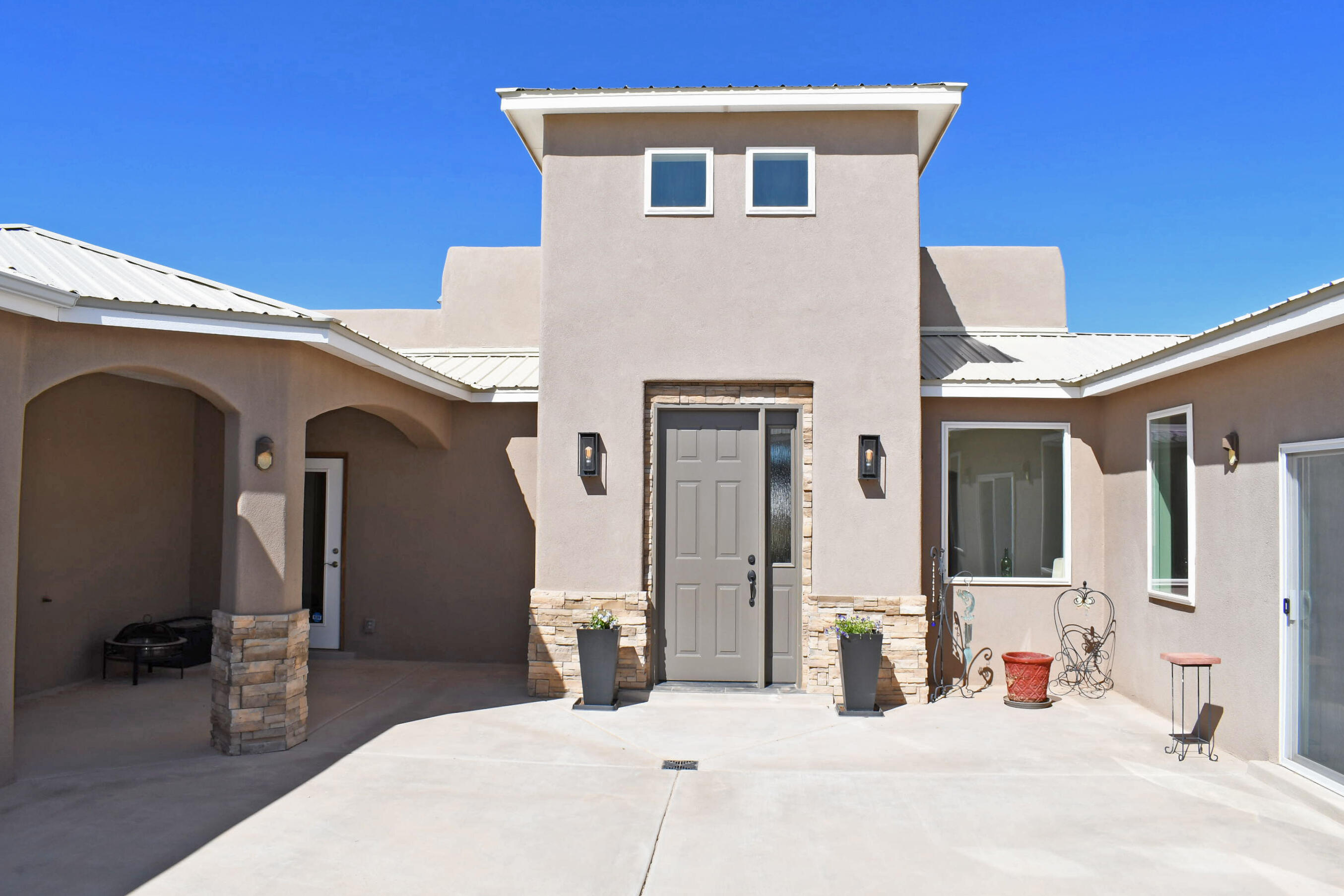 Open House May 7th Saturday 1 to 3PM This custom one story home was built for multi-generational living. Maybe your use would be Air B&B, InLaws, Caretaker, Group home, Home Office, or other unique purpose. Luxurious Courtyard  windows and 5 skylights flood all the home with natural light. Master and 4 BRs on one side, 2 more masters on the other. Dining & Grt Rm windows have view out to swimming pool. All doors are wide, no carpet, individual heat and cooling controls for each Rm. Grand gourmet kitchen with huge island, quartz counters, Farm style sink, island sink, coffee bar sink, built-ins. Solar lease eliminates electric bills. Very efficient! No HEAT was turned on this winter!!  Beauty and quality abounds! 2 double garages are 26'deep.