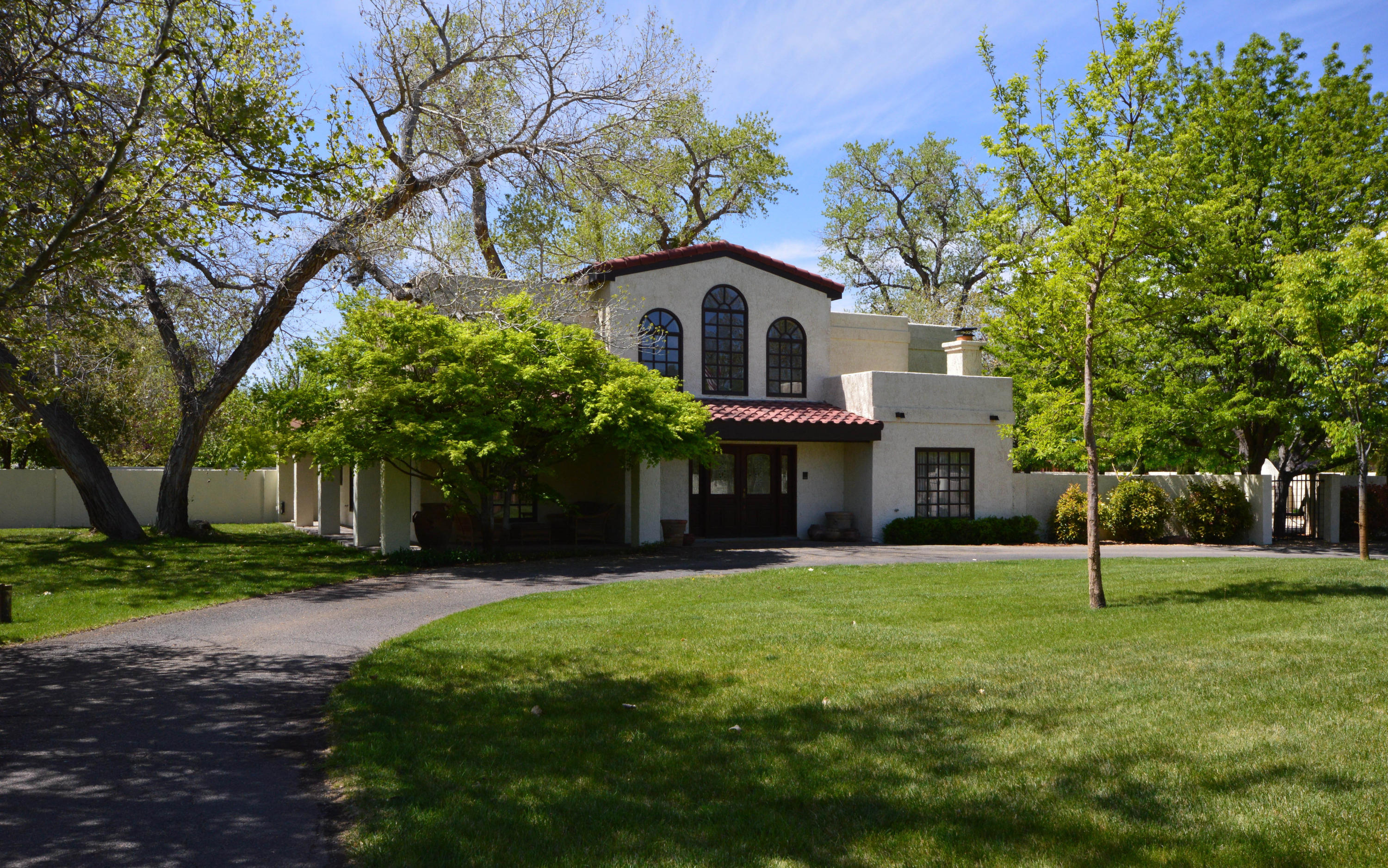 Located on a gated .72 acre lot in the North Valley, this fabulous home has a dramatic 2-story entry, formal living room, dining room & family room w/fireplace & builtin book shelves. Wood paneled study w/fireplace. Large kitchen has lots of cabinet & counter space, island w/gas cooktop, builtin desk, huge walkin pantry & separate breakfast room/morning room. 3 spacious upstairs bedrooms including master suite w/fireplace, private balcony, bath w/jetted tub, separate shower, sauna & vanity w/2 sinks. Fourth bedroom & bath on first floor, ideal for guest or in-laws. 3 car garage & large driveway w/room to park RV/boat & 6 cars. Yard has lots of grass, 2 large cotton wood trees, fruit trees, bushes, 2 covered patios, 2 open patios, inground pool & hot tub.