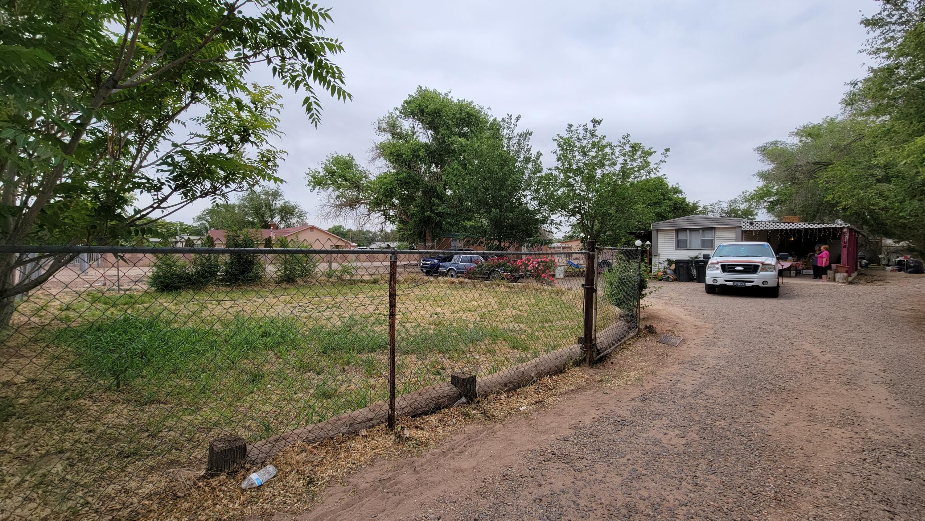 Come see this well maintained 3 bedroom 1 3/4 bath mobile home on .51 acres with an irrigation well, 2 carports, 2 storage sheds, a wheel chair accessible ramp and a covered patio!  This one owner home has a newly remodeled bathroom and comes with all appliances including refrigerator, washer and dryer and all the land you need near the city!