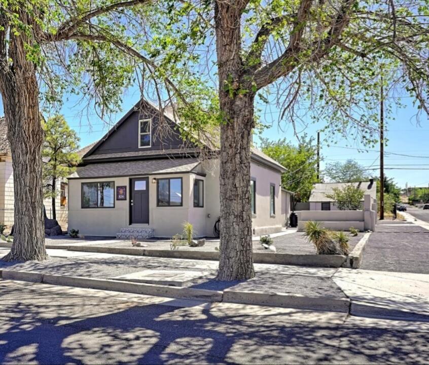 This 1920's home has been completely transformed and is nothing short of IMPRESSIVE! Located in the historic Huning Highlands/EDO area . Centrally located with amenities like the rail yards, downtown, growers market, UNM and Nob Hill close by. This home has been completely updated, from the engineered wood flooring throughout, to the brand new GORGEOUS kitchen with pantry and a built-in buffet!  Updated bathrooms with glass shower doors in both! (glass to be installed soon)  3 large bedrooms, office, formal dining, large laundry room and for the wine aficionado, your very own WINE CELLAR! Flagstone side patio area with a pomegranate tree and a large pond. Single car garage with work shop, backyard access, chicken coop and MORE! A home like this is truly one of a kind and a rare find.