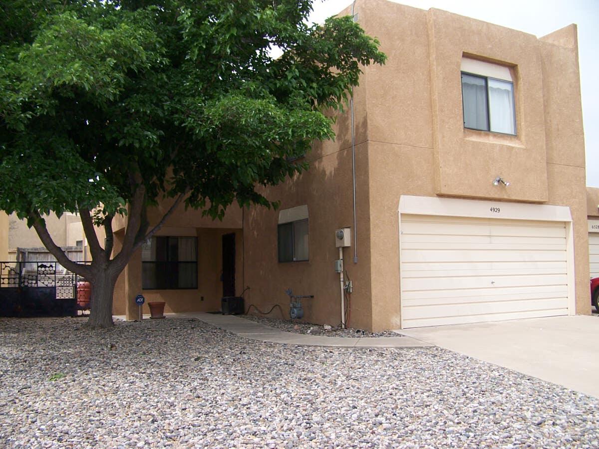 Three bedroom, 2.5 bath townhouse (no HOA) south of Montano and Unser (Santa Fe Village). Quiet neighborhood - subject is at the base (low traffic section) of a loop road.  Gas oven and Side-by-side Fridge with in-door water & ice convey.  Kitchen/dining area has large walk-in pantry.  Countertops are solid surface Corian.  Big 280 sq ft Great Room.  Polybutylene piping replaced with copper.  Backyard is mostly slate rock and there is backyard access.  Just a short walk takes you to a library, dog park or escarpment hike.