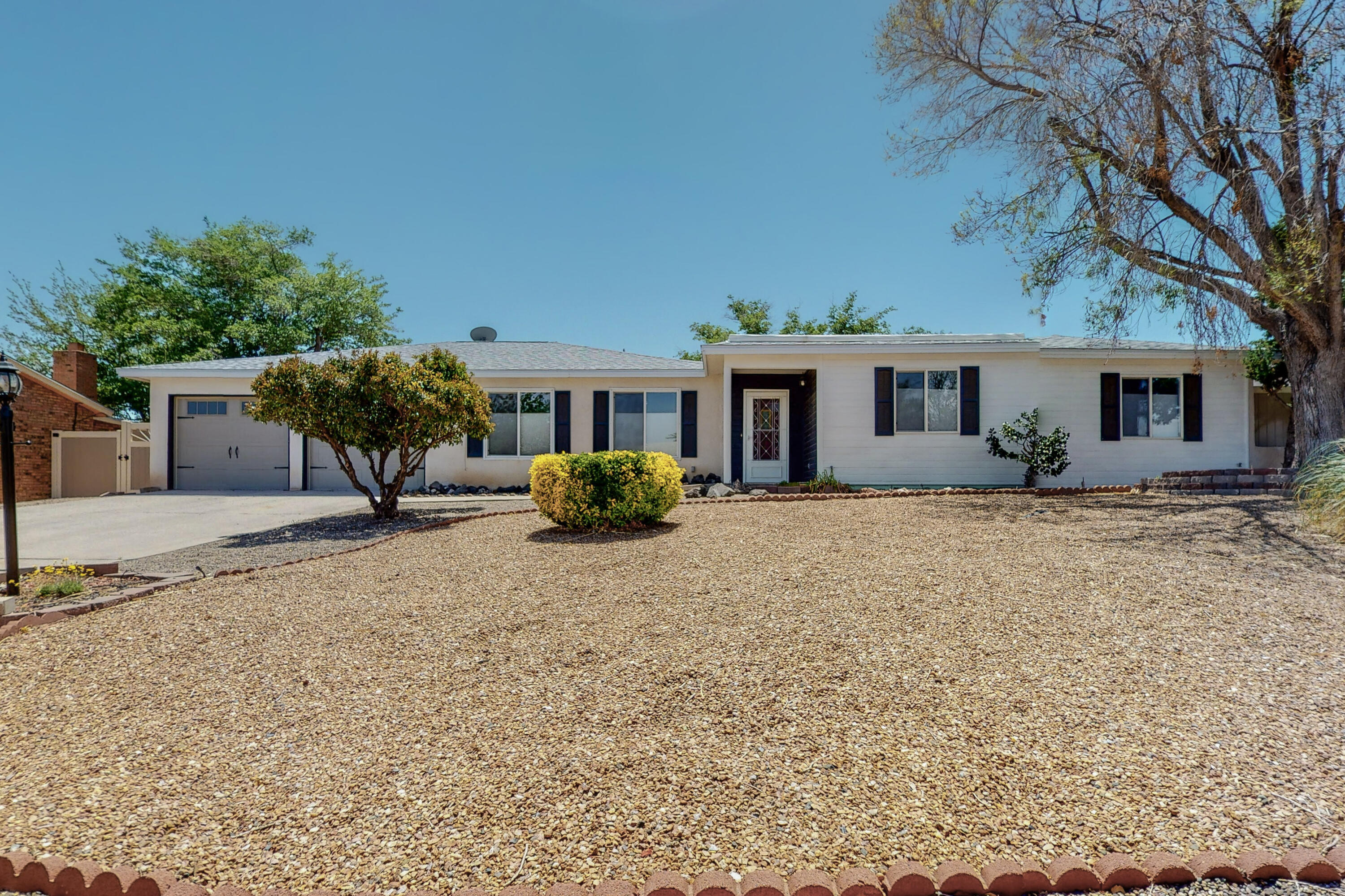 This home has been meticulously cared for and pride of ownership is evident! Located in the heart of Rio Rancho close to all amenities. Large .27 acre lot on a cul-de-sac. Fresh paint this May and REFRIGERATED AIR CONDITIONING! Roof is 3 years old, water heater 4 years old*Beautiful REMODELED KITCHEN with contemporary white cabinets and stainless appliances* exterior of refrigerator matches cabinets*glass accents*terrific oversize laundry room with a convenient 1/2 bath* 2 extra large living areas and/or formal dining.*Pellet stove for cold winter nights*HUGE BACKYARD has VINYL FENCING for no maintenance* mature landscape*storage shed*green house*water feature*front yard is easy care* If you want room without HOA or PID this is your place to call HOME!