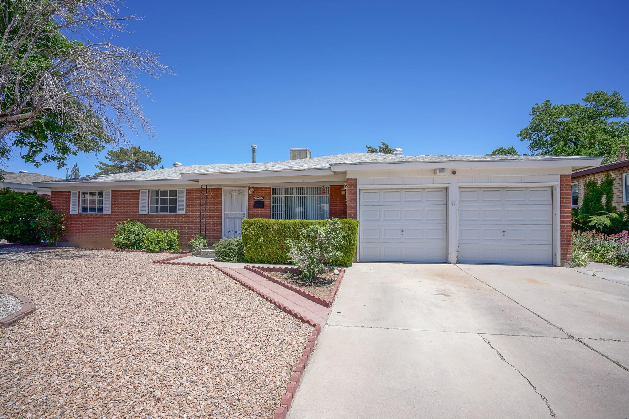 Wonderful Sandia High School district home.  Brick, pictched Wood floors .22 acre Walled Backyard. Freshly painted , new outlets wonderful potential on the upside.  Large two Car garage plus Shed in back, newer pitched roof.Well landscaped in front with low maintenance low water use  Backyard is private and wonderful.