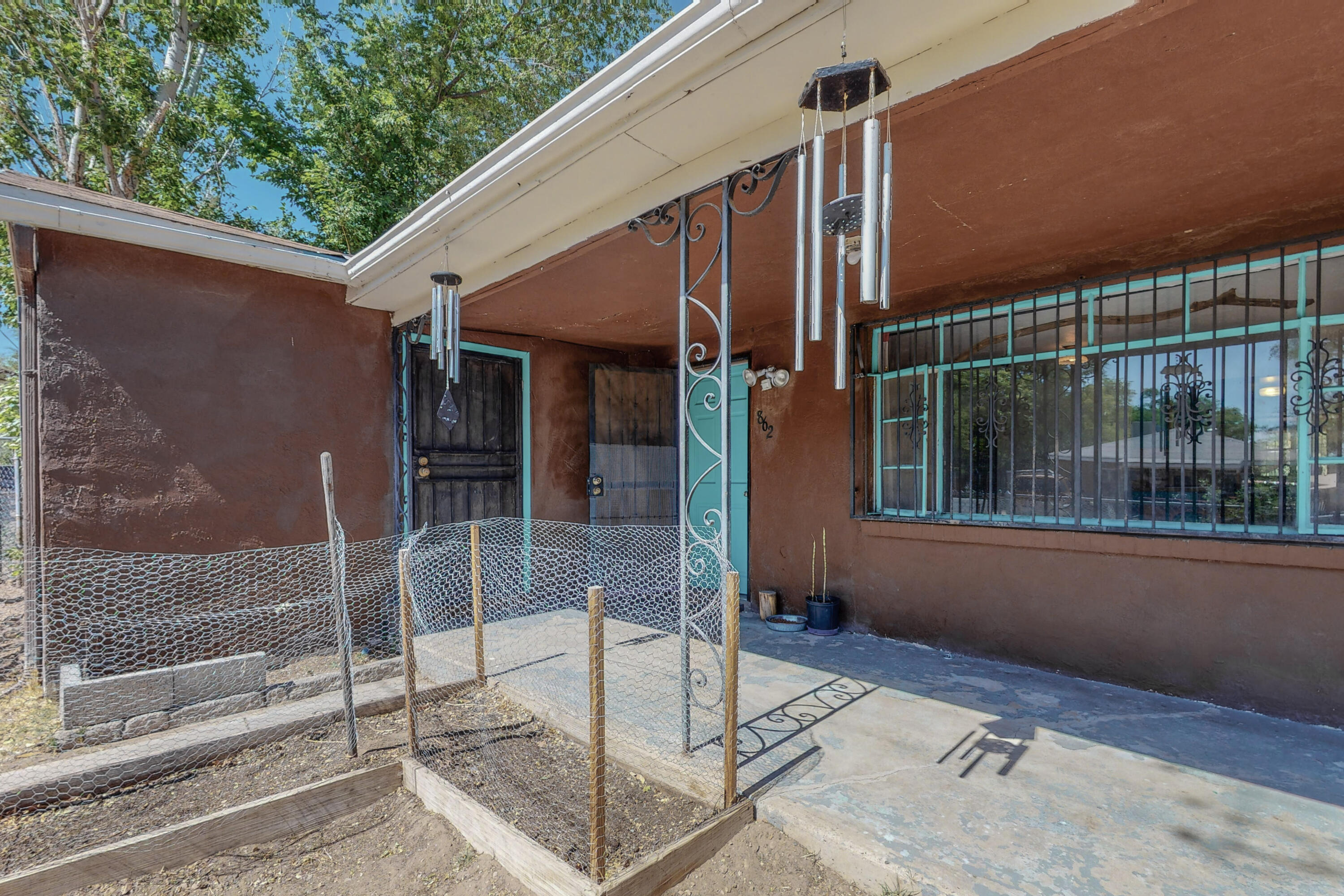 UNDER $200,000! This South Valley charmer with wood floors has everything you're looking for and so much more potential. Side yard access! Grape Vines! Within a half mile to the Bosque trail and the community center. You'll have plenty of activities at your disposal like the Dia De Los Muertos parade and the annual South Valley Parade. Come see this one before it's gone.