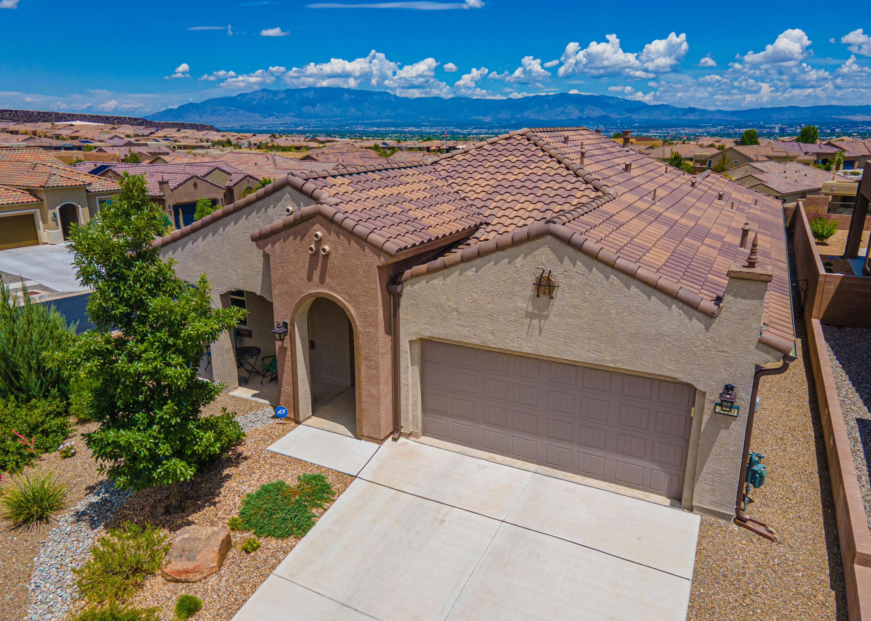 GEORGOUS HOME WITH FOREVER VIEWS LOCATED IN THE EXCLUSIVE COMMUNITY OF DEL WEBB MIREHAVEN!! This 1678SF Home Sits High On a Premium Corner Lot with SPECTACULAR Views of the Sandia and Manzano Mtns and City!!  Home Was Built With Many Upgrades Including:  Beautiful Wood Look Tile Throughout, Tray Ceiling & Bay Window in the Master Bedroom, Bonus Room/Office, Corner Fireplace, Extended Covered Patio, Gas Stub-out, Gas Oven, Kitchen Has 'Chiffon' Cabinetry with 'Desert Accents', Window Blinds, Free Standing Mud Sink In Garage, Custom Storm Door at Front, Gutters & Custom Landscaping!! Home Backs to Open Space!  Backyard Wall is Raised on Each Side and You'll Love the Privacy!! All Appliances Stay!! Enjoy Daily Activities, Pickle Ball, Tennis, Pool, Jacuzzi, etc at the Sandia Amenity Center!!