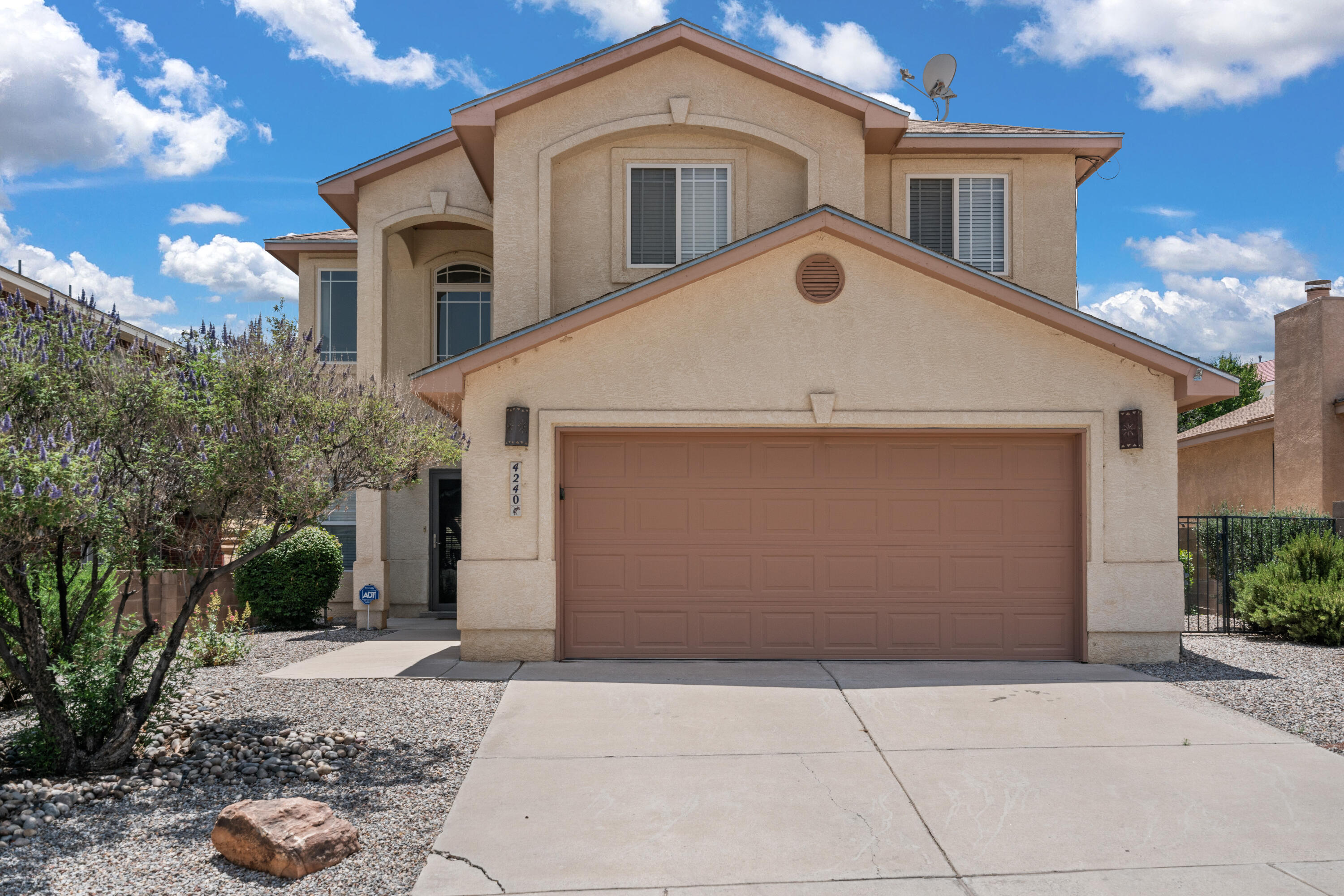 Beautifully maintained home located in the desirable Cottonwood Hills neighborhood!   Professionally landscaped front yard with mature trees.  Enter the home into an open and inviting foyer with vaulted ceilings.  Living area is light and bright with a lovely stone tiled gas fireplace.  The custom kitchen is adorned with alder wood cabinetry, granite countertops, stainless steel appliances, a wine fridge and a walk-in pantry!  Owners' suite is spacious with a closet outfitted by California Closets, large glass shower, and a heated jetted tub. 3 bedrooms, an office and an oversize loft offer plenty of space!  Refrigerated air and a water softener!   The backyard boasts a large wood-covered patio perfect for entertaining as well as a secluded seating area with Sandia Mountain views!