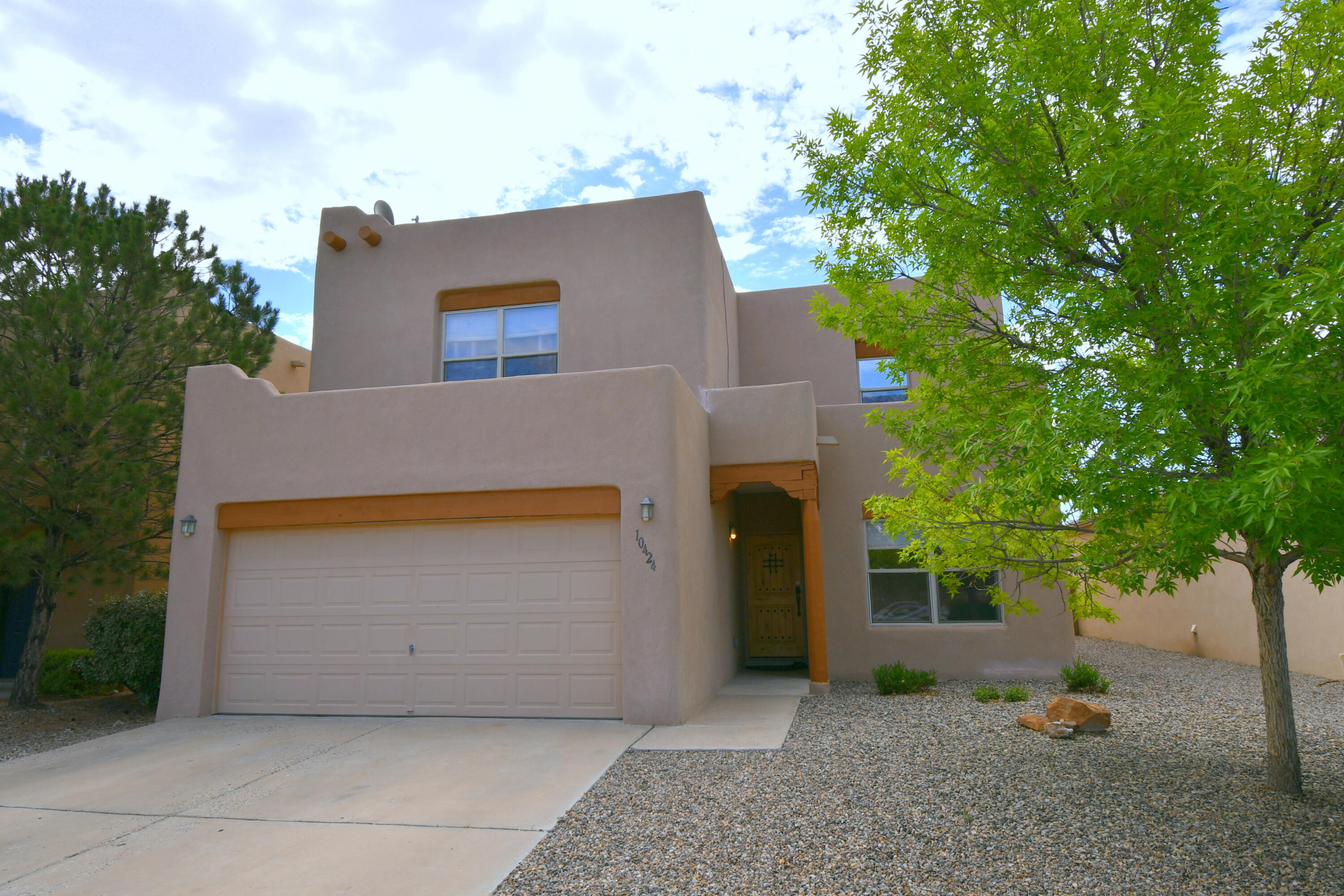 Beautiful Home w/ 4 bedrooms and 4 baths, Large Master Suite, Luxurious Updated Master Bath, a garden tub, separate shower, double sinks, 2-way gas log fireplace, walk in closet, and balcony w/ views of the Sandias. Large kitchen w/ granite counter tops, recessed lighting, re-finished cabinets, updated doors/hardware w/ bar seating, open to the breakfast nook and Family Room. One Bedroom has a Full En-Suite Bath (Perfect for Guests), 2 Living Areas, 2 Refrigerated Air Units for maximum comfort. Large Laundry Room. Relax after a long day on your covered flagstone patio and lovely landscaped backyard w/ low maintenance synthetic grass. Great Curb Appeal w/ a Beautifully Xeriscaped Front Yard. Walk to the numerous beautiful parks and Community Pool. Great School District. MOVE IN READY!!!