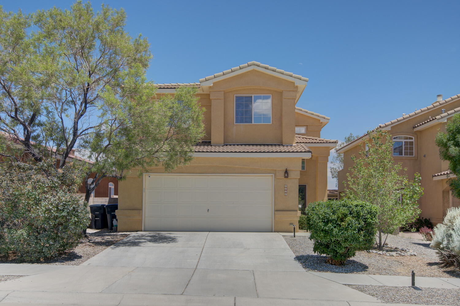 OPEN HOUSE SAT 1-3 You'll be delighted with the unobstructed Mountain, Sunset, Balloon Fiesta Views from this  lovely home.  The property backs open space so you'll never have a neighbor backing your home and will enjoy the space for walks, runs, and enjoying the wildlife that visit.  Many recent updates include the lighting fixtures, some appliances, countertops.  Tile graces the floors downstairs, laminate upstairs   Enjoy the loft, view deck and 3 bedrooms upstairs.  The primary suite features views, a garden tub, separate shower, double vanity and walk-in closet.  Downstairs enjoy a fireplace, access to the covered patio, kitchen/dining area and VIEWS!