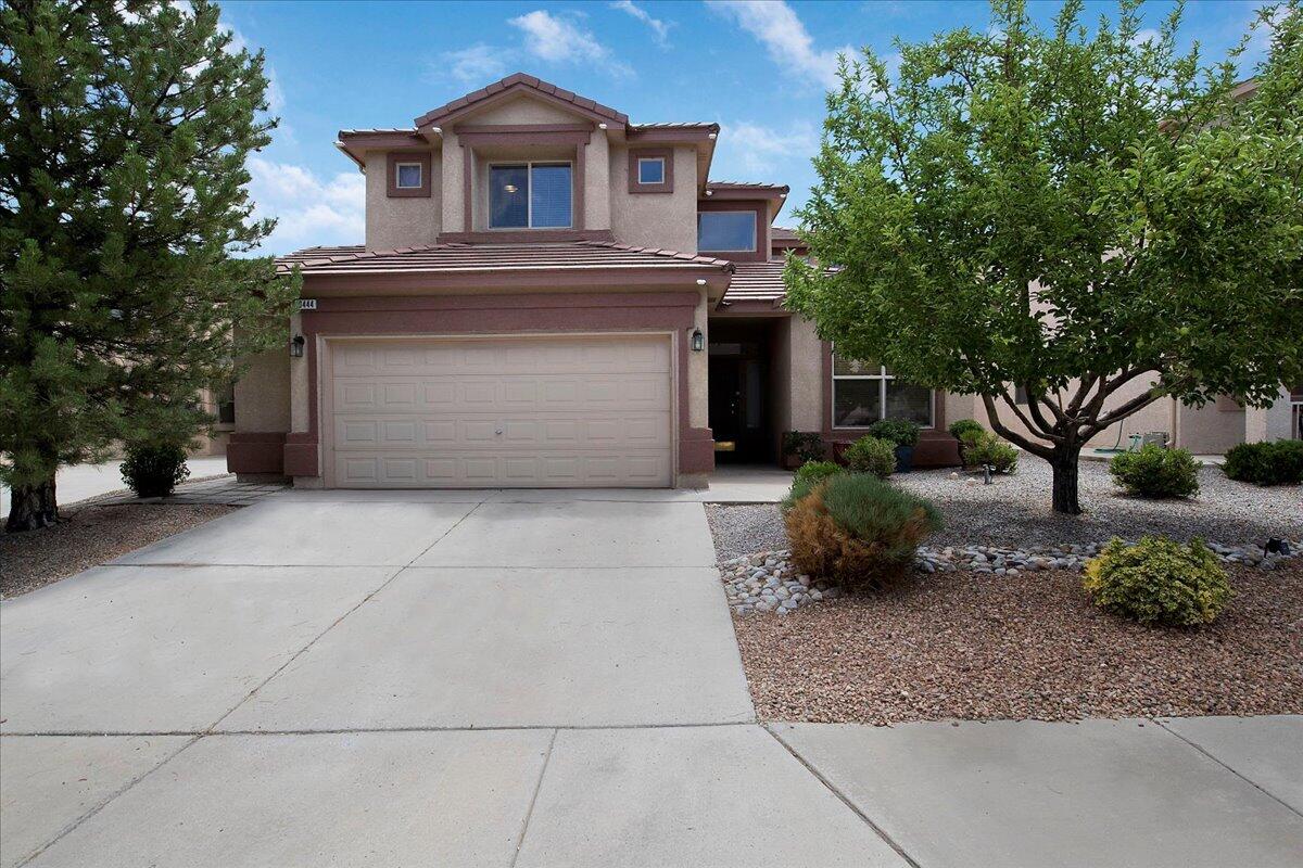 Come check out this beautiful two-story home located in the sought after Ventana Ranch West area!  You'll be greeted with high ceilings allowing for lots of natural light to fill the home and a view to an immaculate backyard ornamented with grape vines draping on a custom-built pergola, rose bushes and fruit trees lining the perimeter of the backyard, and a koi pond situated in the corner of the backyard. On the main floor, there is a breakfast nook in the kitchen and a large walk-in closet in the master bedroom.  Going upstairs, you'll find 2 bedrooms, a loft, and a spacious balcony to enjoy the views of the backyard below and the Sandia Mountains.  Tiled roof and xeriscaped front yard.  All new luxury vinyl plank flooring and carpet installed in June 2022!  Schedule your showing today!