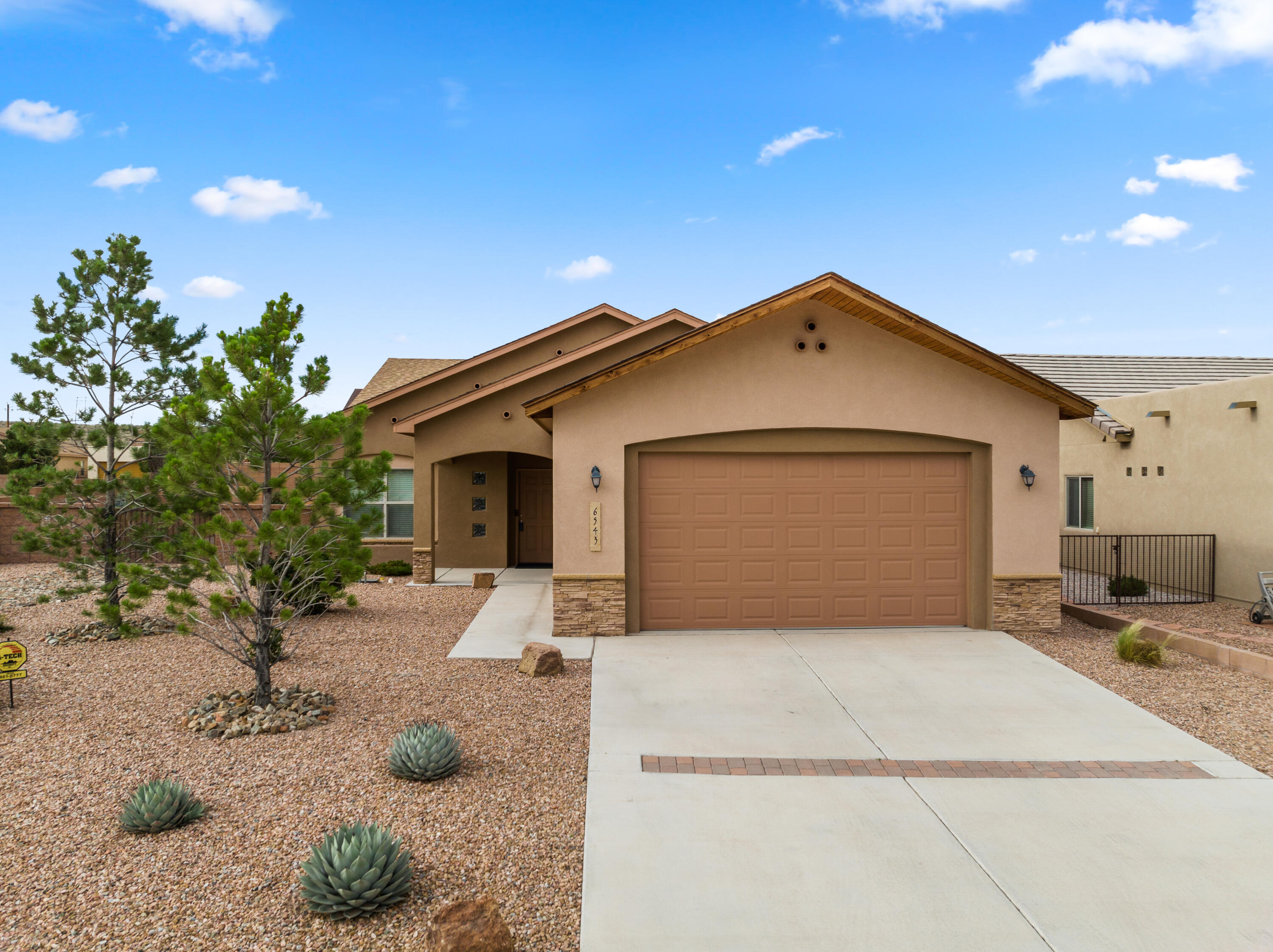 Paul Allen was one of the best Green Builders in Albuquerque.  This home was certified both by Build Green NM and Home Innovations, under the ANSI approved National Green Building Standard. Built in 2015, this home sits on a premium corner lot with beautiful views and has a lovely backyard Oasis, perfect for entertaining! The backyard has side access, flagstone, covered and open patios, power for Hot Tub, and fantastic landscaping! The kitchen is open to the living area and has stainless steel appliances, tile countertops, kitchen island and pantry. Second living area with gas fireplace and an abundance of natural light. The primary bedroom has a patio door and a nice walk in closet. Second bedroom is good size and there is an additional room off the garage that would make a great workshop