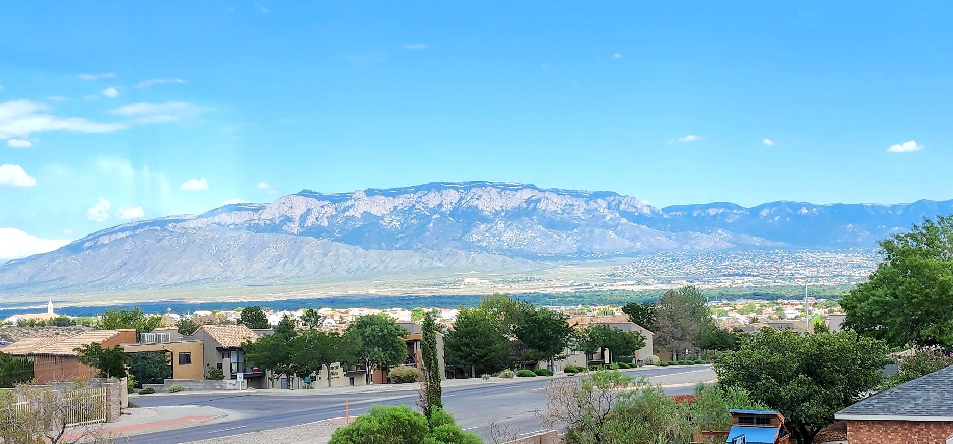 Great Floorplan with lots of natural light and gorgeous VIEWS of the Sandia Mountains. Located in the Paradise Greens Community. This home has 3 Bedrooms plus a Theatre room. 2 and 3/4 Bathrooms with a 3 Car Garage. This home is situated on a .25 acre lot and has easy access to shopping and entertainment.