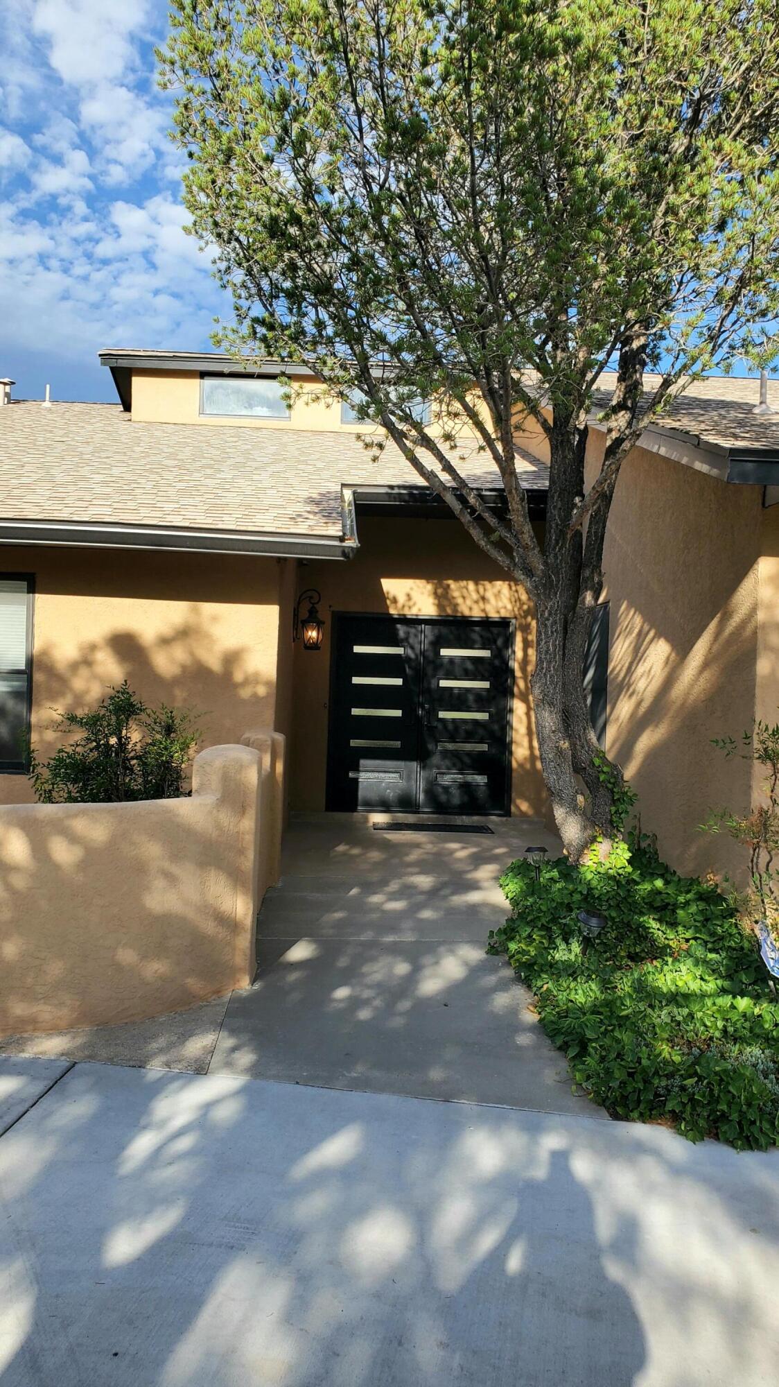 VIEWS! This PREMIUM LOT SINGLE LEVEL home backs up to the 14th hole of DESERT GREENS GOLF COURSE and offers GORGEOUS VIEWS of the SANDIA MOUNTAINS which can be enjoyed from the covered patio, living room and dining room. Enter the home into a lovely fower with new BENCHMARK HICKORY FLOORING, VAULTED CEILING, CLERESTORY WINDOWS, FIREPLACE and VIEWS!  The kitchen was recently remodeled with QUARTZ COUNTERTOPS and NEW APPLAINCES including a DOUBLE REFRIGERATOR. The primary bedroom is separate from the other bedrooms and at the opposite end of the house is a huge 4th bedroom with an attached 1/2 bath, walk-in closet, small office and separate entrance.  New roof and waterheater. There is room for RV PARKING and also GOLF CART ACCESS.  Make this DREAM HOME yours today!