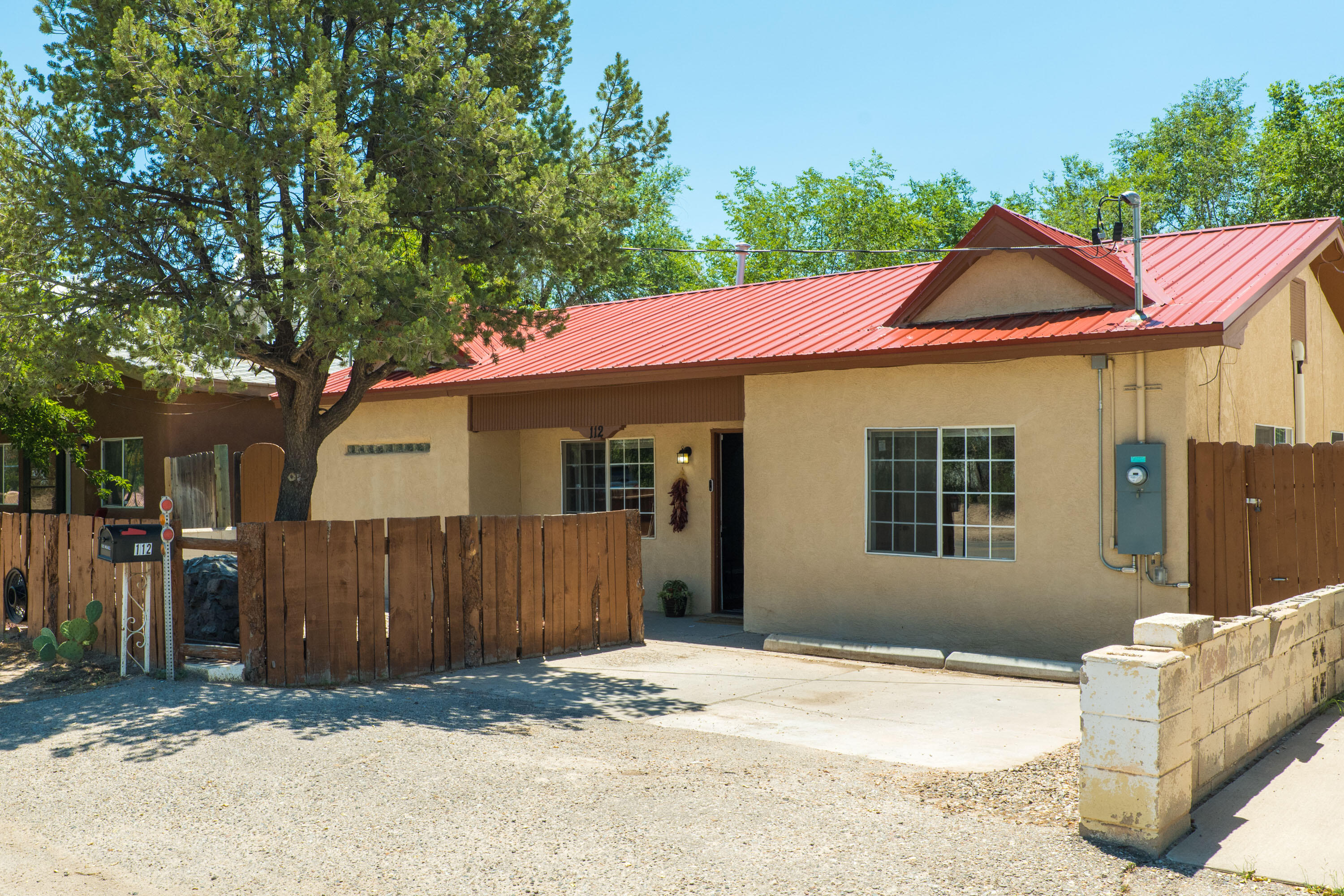 Welcome to this Charming, Updated, Affordable Single-Story Home in the North Valley! 112 Ranchitos offers 2020 HVAC/Furnace/Refrigerated Air, Newer Laminate Flooring, plus a Pitched, Metal Roof! Renovated, Modern Kitchen features Granite Counters, Stainless Steel Appliances. All Appliances plus Washer & Dryer Included. Low-Maintenance Landscaping + Big Backyard with Covered Patio, Fire Pit, Storage. Make an appointment to see this Home today!