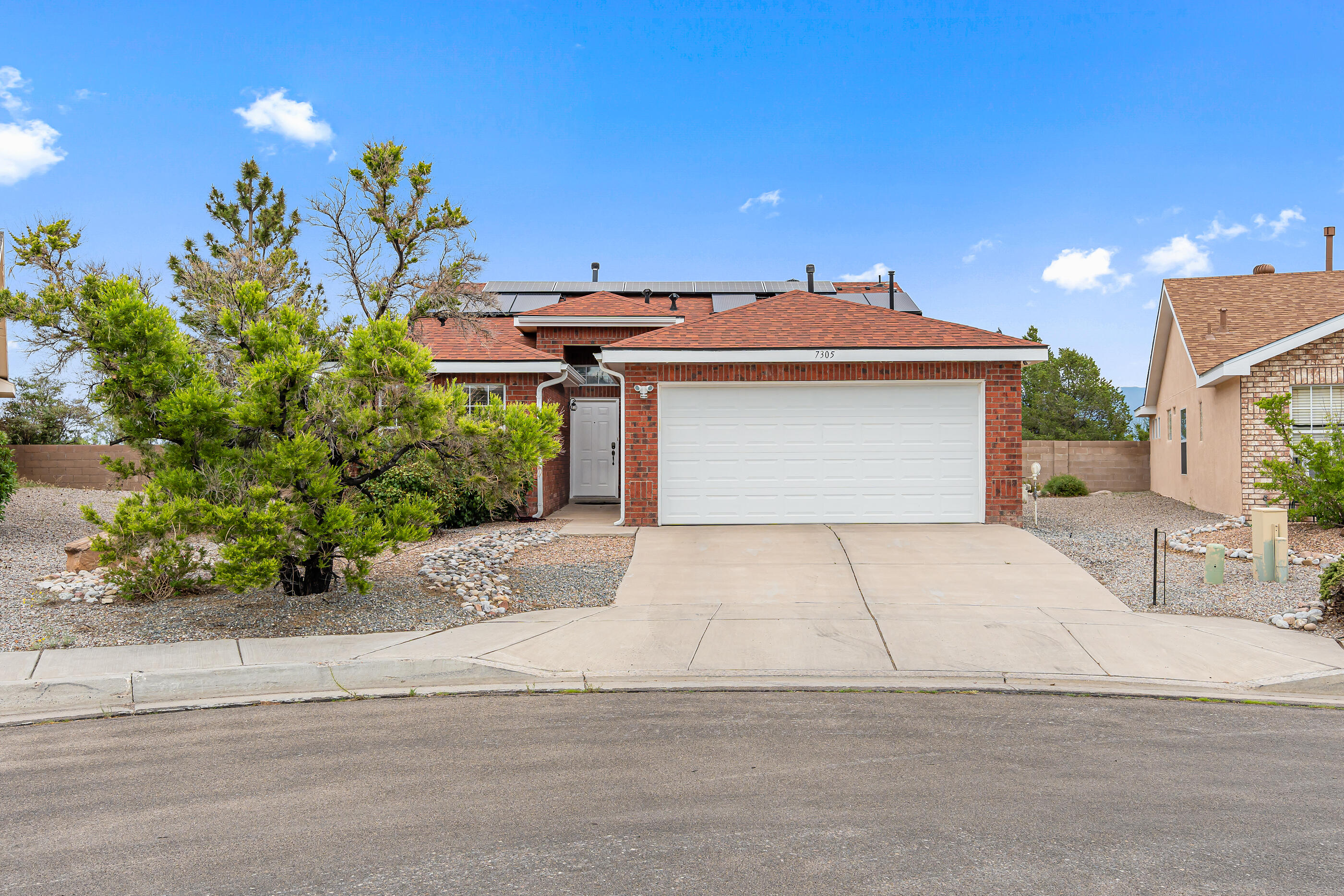 Save with this home! Newer roof, installed in 2018. Solar panels on home, Laminate Flooring in all 3 bedrooms and tile in both bathrooms and kitchen. Open Floorplan, Cathedral Ceilings, Move in ready! Don't forget to look at the beautiful landscaped backyard.