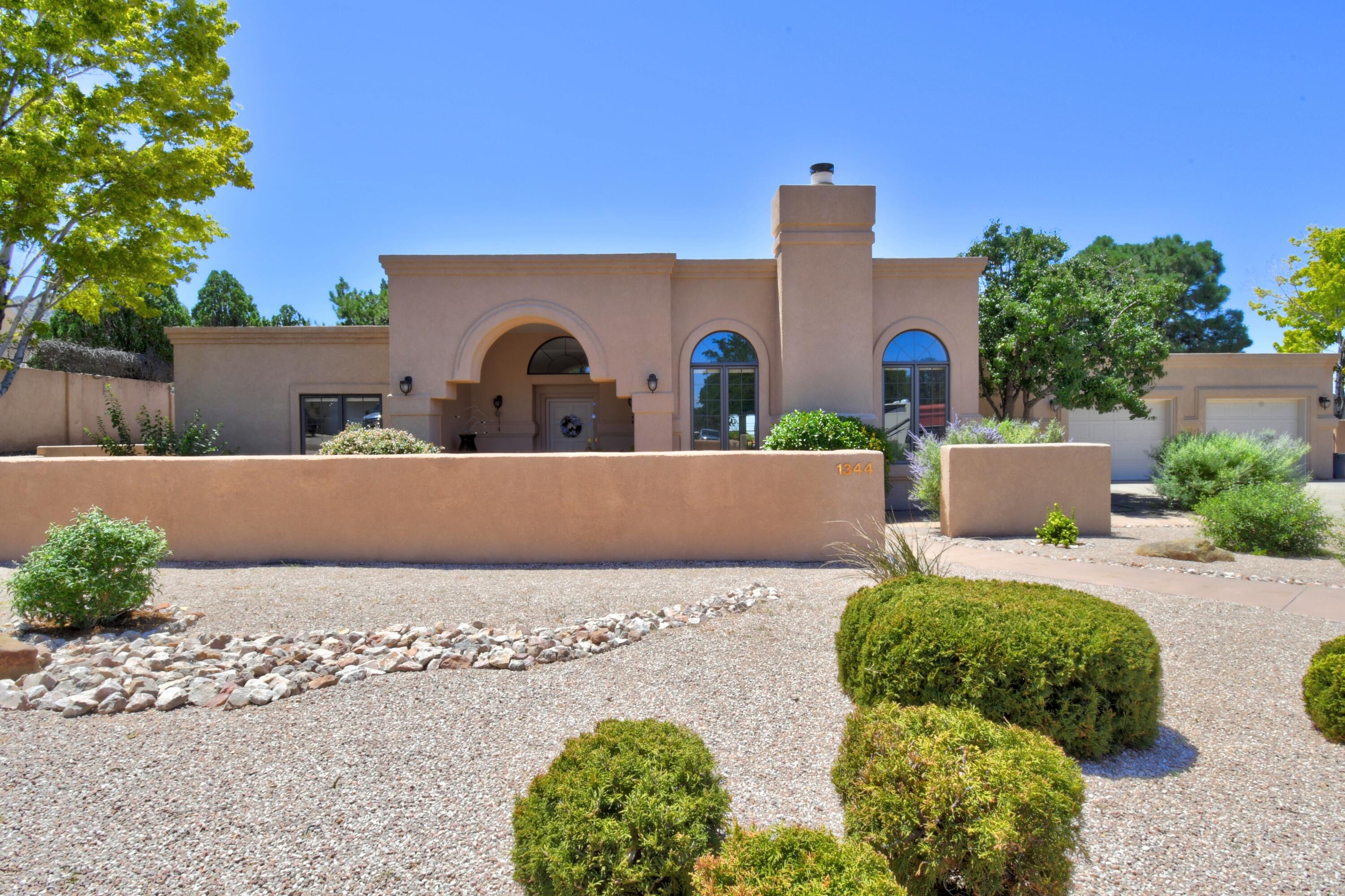 Stunning Four Hills Home, close to Canyon Club Golf Course. Gorgeous NM skyline backing up to open space, this 3 bedroom, 4 bath, single-story custom home offers panoramic views. Newly remodeled kitchen (2021) with black stainless appliances, instant hot water, pot filler, custom maple cabinets, Brazilian natural stone counter tops and large pantry. Prep island with sink and garbage disposal. Extra storage throughout, radiant heat, HVAC system, high ceilings and plenty of skylights. Wet bar with wine fridge and marble counter top. New TPO roofing (2021). Spacious yard features a 16x32 Gunite pool, 2 storage sheds, greenhouse. Extra large 1200 sq ft garage offers plenty of room for 4+ vehicles. Loads of upgrades and added features, Perfect home to entertain.  You can't miss this one!