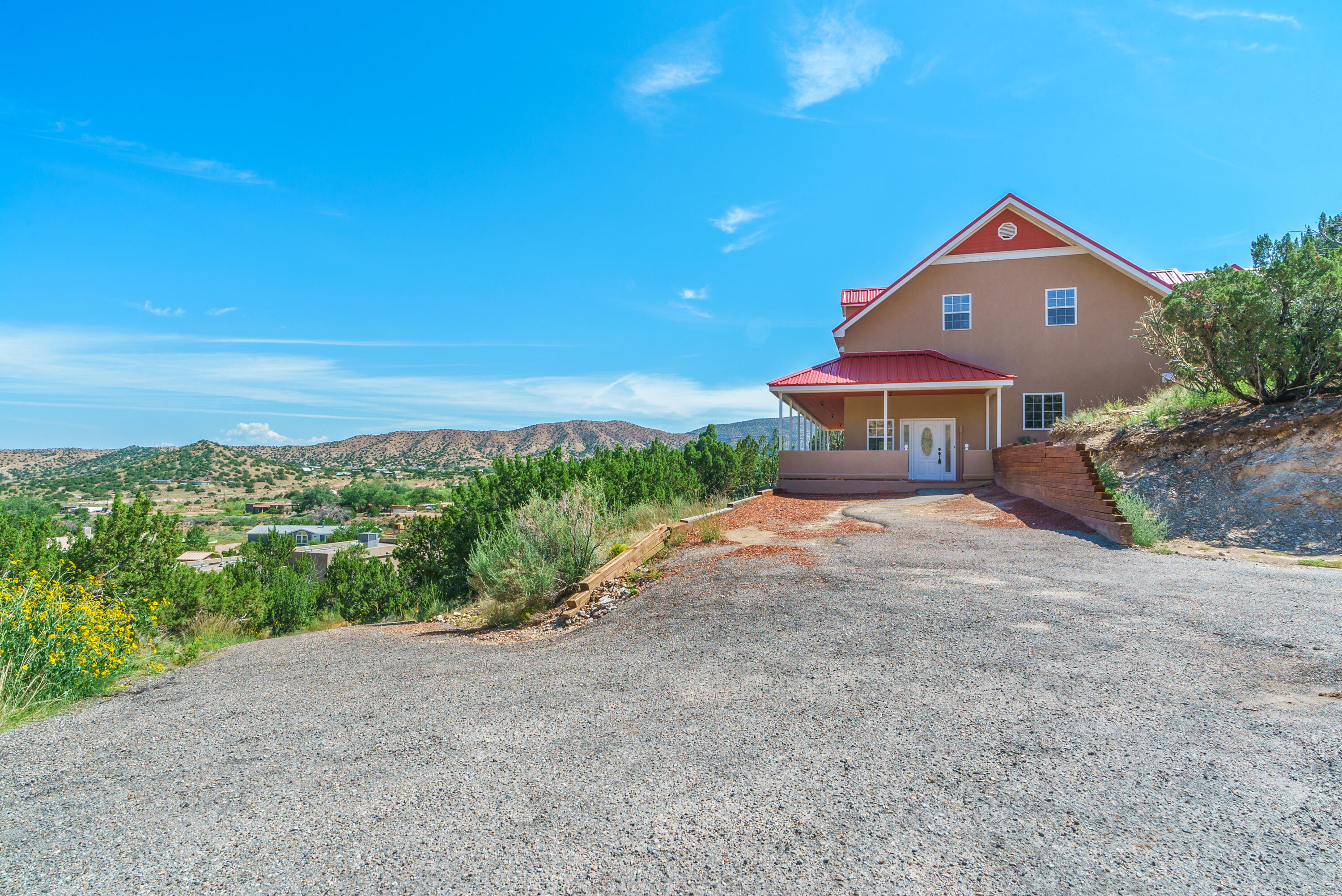 Amazing custom 2 story Ranch home located in the beautiful Village of Placitas! Sitting up on a hilltop on 1.55 acres and a full wrap around porch, you are surrounded by nothing but nature. Home features 3,480 sq. ft. w/4 Bedrooms, 3 baths, and a 400 sq. ft. Garage Plus additional single car garage or storage! Gourmet Kitchen with maple cabinets, granite countertops and backsplash, bartop with room for seating, and tile floors. Main floor features a private bedroom and bathroom. Head upstairs to a Loft and 3 more bedrooms! Huge Master Suite with walk-in closet and private bathroom. Bathroom has a large soaking tub, walk-in shower, granite countertops and tile floors. Don't miss out on everything this home has to offer!