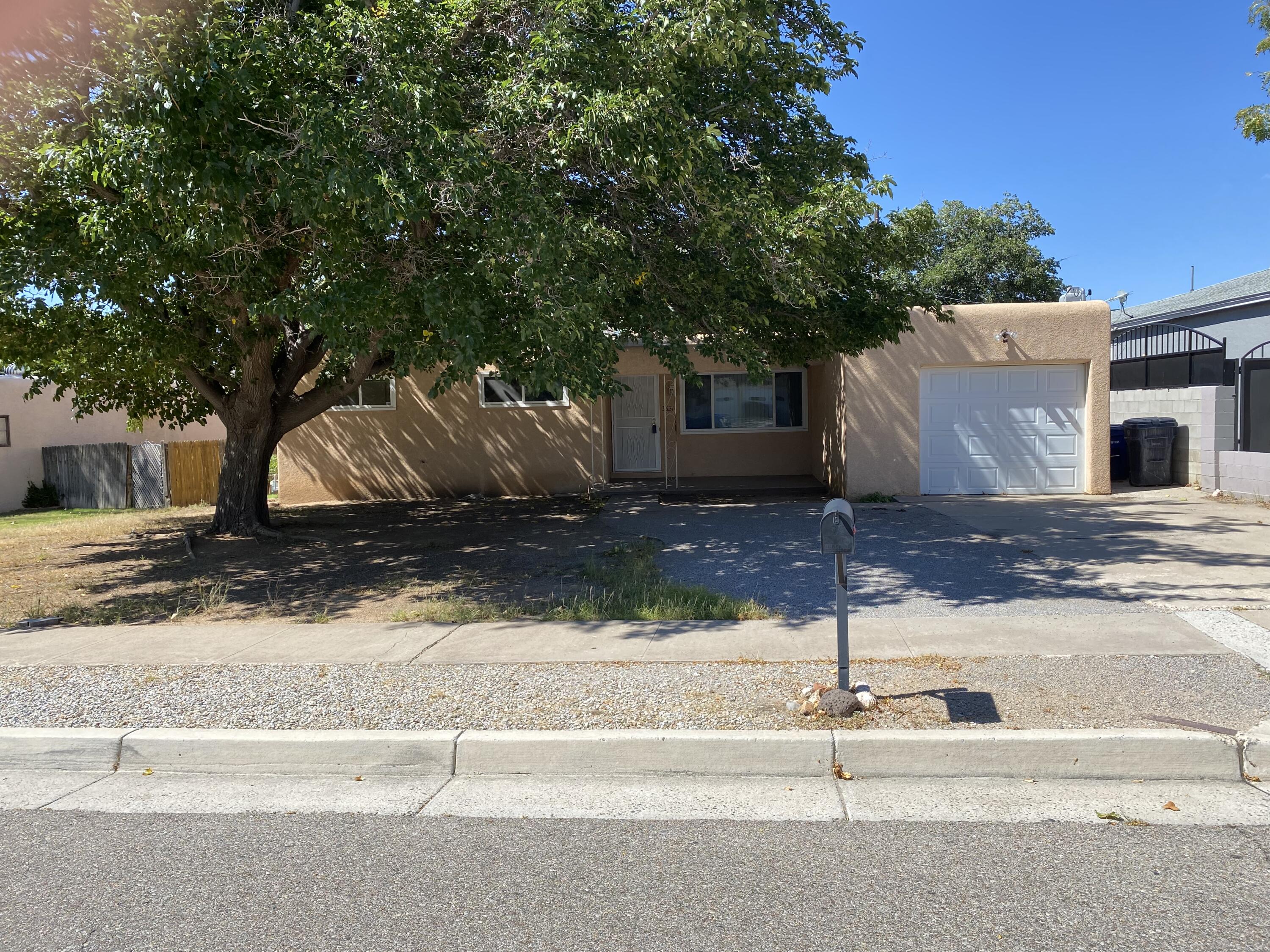 Fantastic Roberson home with hardwood floors, closet built ins and crawl space in NE Albuquerque.  You won't want to miss this 3 bedroom , 1 3/4 bath with a single car garage.  Formal living room, large kitchen which is open to the cozy den with fireplace.  Large walled backyard.