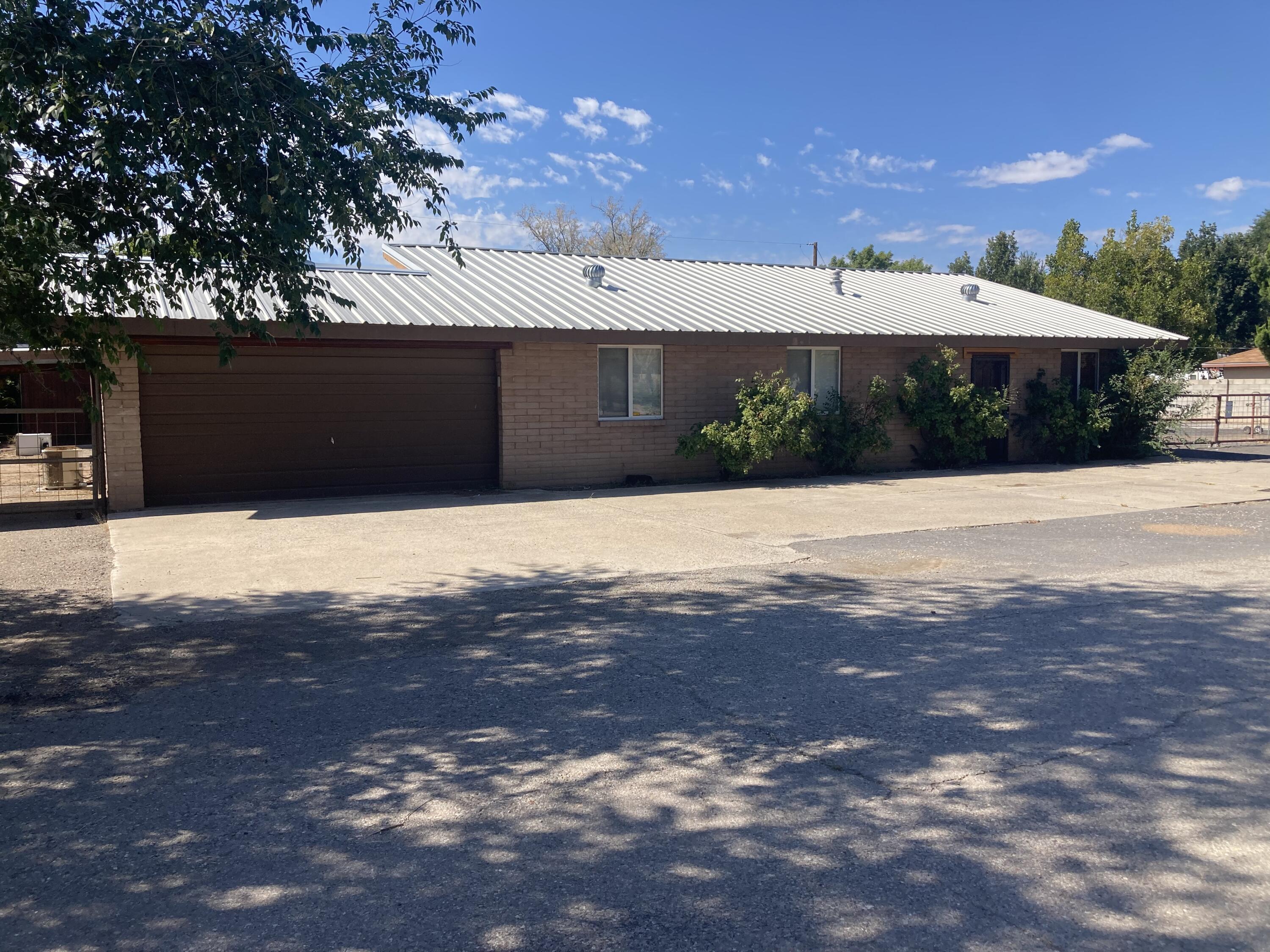 Great property with large fenced in yard. Beautiful wood beams with open concept. Cute horse barn with stalls.  2 horses allowed. Spacious tack room/storage/workspace. Plenty of room for parking large trailers. Nice back porch with lots of room to entertain.