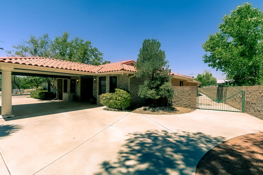 This north Valley custom built, one owner, well maintained corner lot home is a must see. Mature landscape with side yard room for RV. This home has 4+ car spaces in the oversized garage and more covered parking both in front and the back of the house. Enclosed patio makes the perfect space for privacy dining and entertaining. The oversized master bedroom has two walk in closets and a side cedar closet for more storage. The house has a formal living and dining area and family room with custom fireplace & access to the patio. Spacious dine in kitchen. Oversized laundry room & bonus space, great for office, exercise, play or sitting area. New Tank less water heater & boiler for base board heating (02-2022), Master cool AC approx 2.5 years, vacuum system though out the home