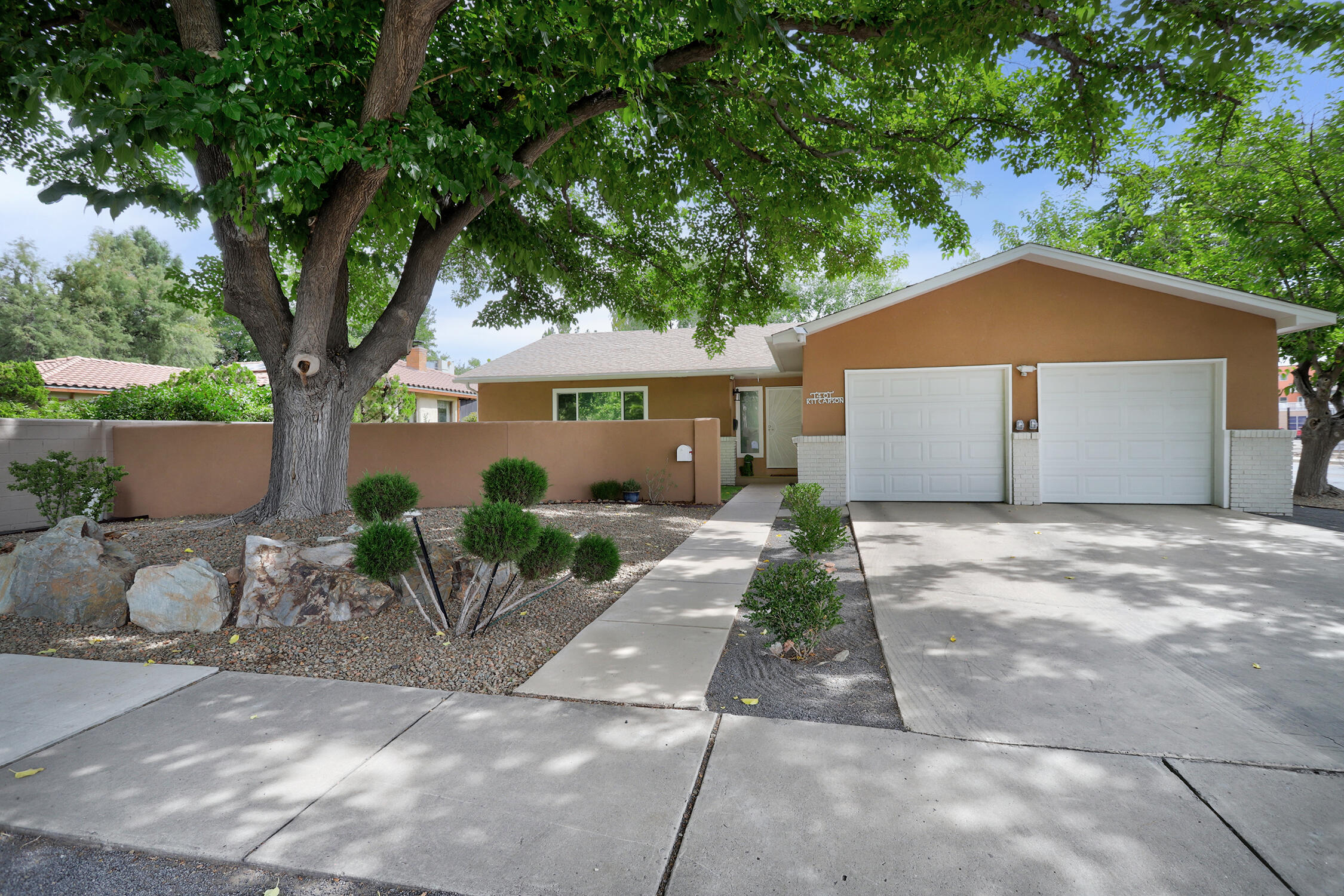**Seller will contribute 1% toward buydown points with acceptable offer!** Rare opportunity to live under mature trees in ABQ Country Club area across from sprawling Rio Grande Park, a dog park, and w/ nearby access to Rio Grande nature trails. Seller recently spent nearly $60,000 in outstanding upgrades. Special features incl: new courtyd wall & plush front landscaping, new east side walls for privacy, energy-efficient Pella vinyl / thermal windows, enhanced insulation for greater efficiency, new sewer line, hardwood floors or tile throughout (no carpet), modernized kitchen with new cabinets / farm sink / SS appliances / new counters, open concept great room, updated baths, 220 Volt charging ports in garage, and phenomenal outdoor living in the fully-finished bkyd. Hot tub & shed convey