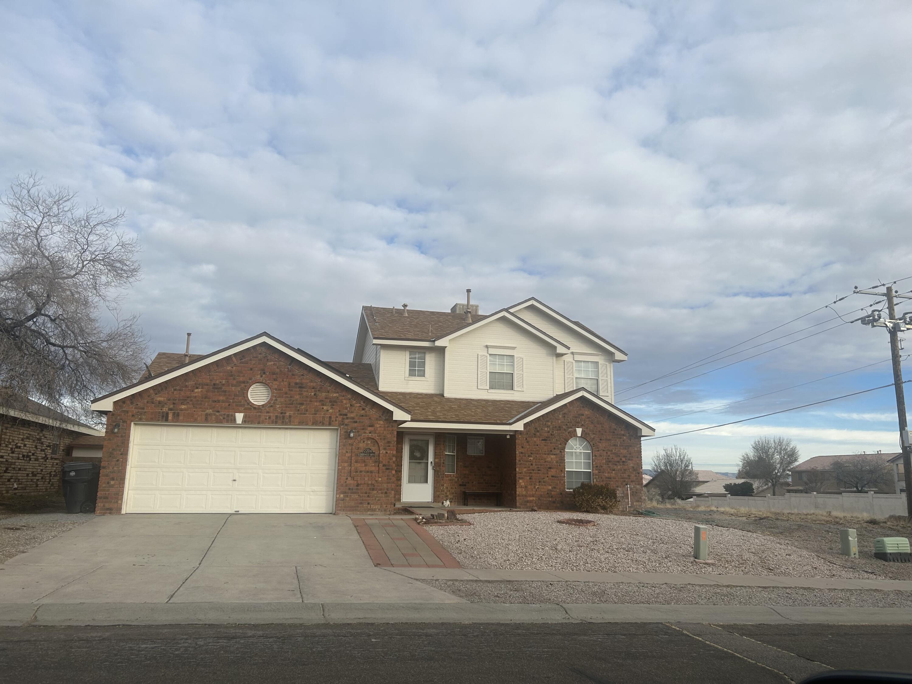 Very well maintained Brick home in North West area. This 3 bedroom 2 bath is move in ready waiting for a new owner. Refrigerator, Washer and Dryer convey. Master bedroom is on the main level, and has an upper loft for study, office, or exercise room. This large corner lot has a upper Balcony with beautiful views of the Sandia mountains. Bring all offers won't last long!