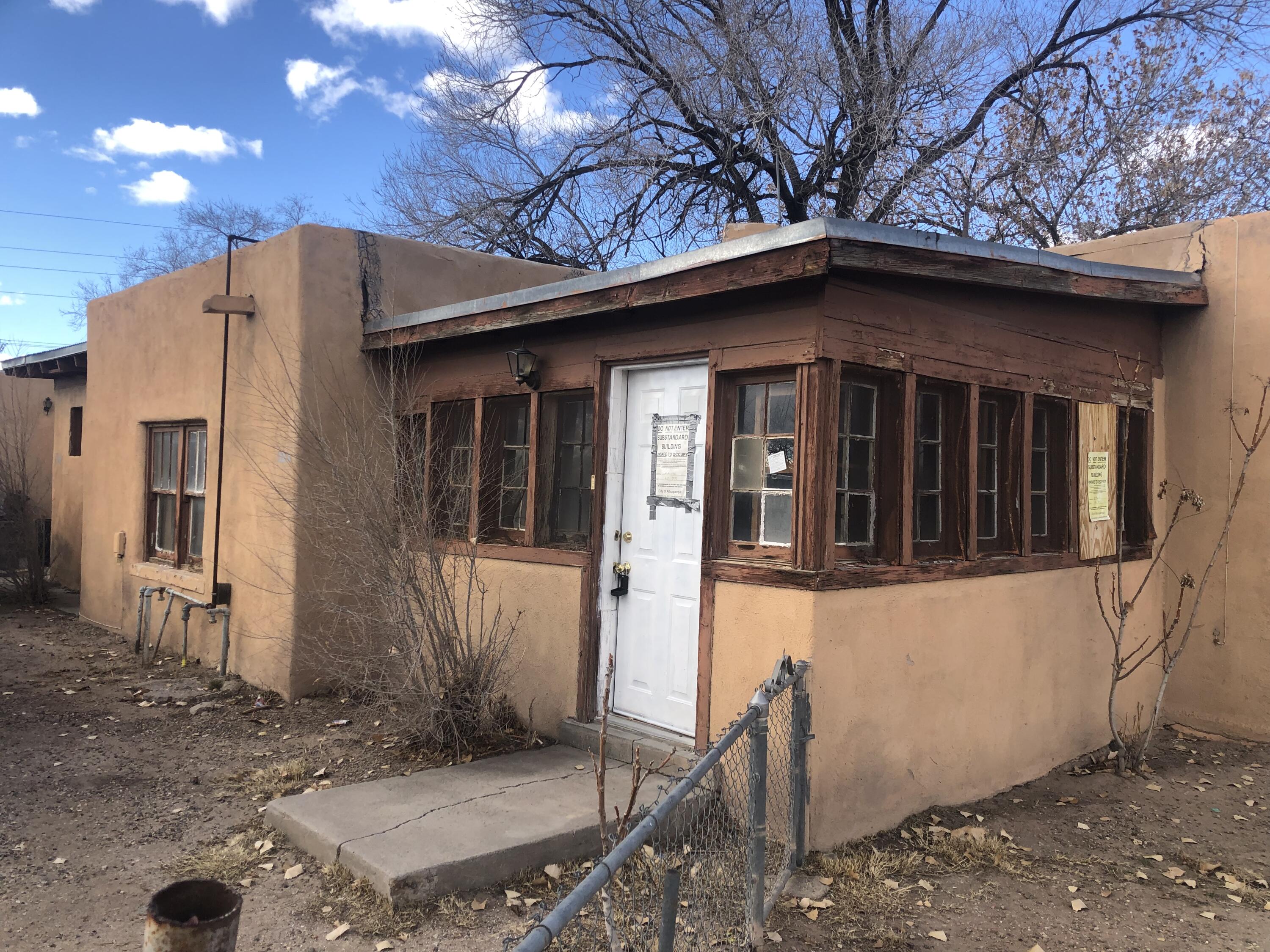 This pueblo style home is located on a quiet street.  Near Old Town Plaza, parks, restaurants, and shopping.  1-2 bedroom unit with 1 bath.  Bring your contractor buyers to renovate this property. The structure has a substandard notice attached to the property.  This property was divided into 3 parts by the prior owner.  The subject unit is the front unit.  The driveway is the easement.